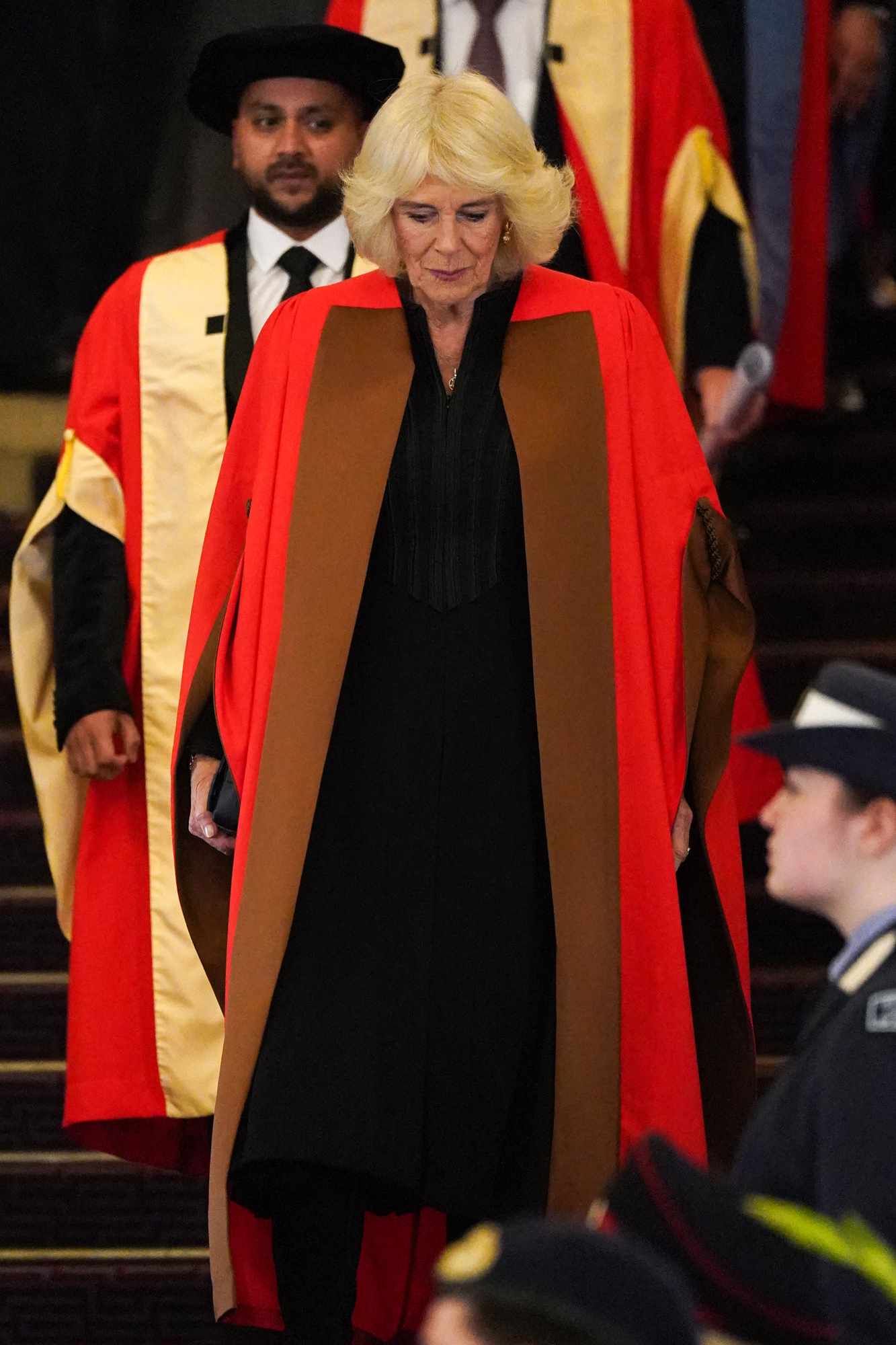 Britain's Queen Camilla prepares to receive an Honorary Doctorate of Literature by Britain's Princess Anne, Princess Royal during a ceremony at the University of London, in London, on November 20, 2024. 