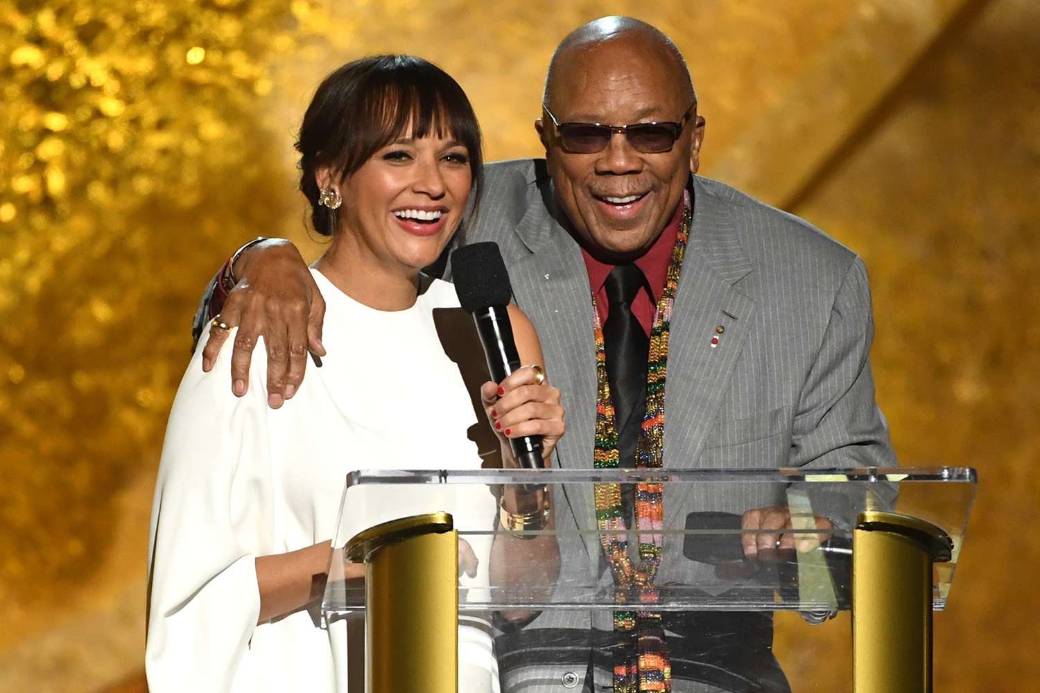 Rashida Jones (L) and Quincy Jones speak onstage at Q85: A Musical Celebration for Quincy Jones at the Microsoft Theatre 