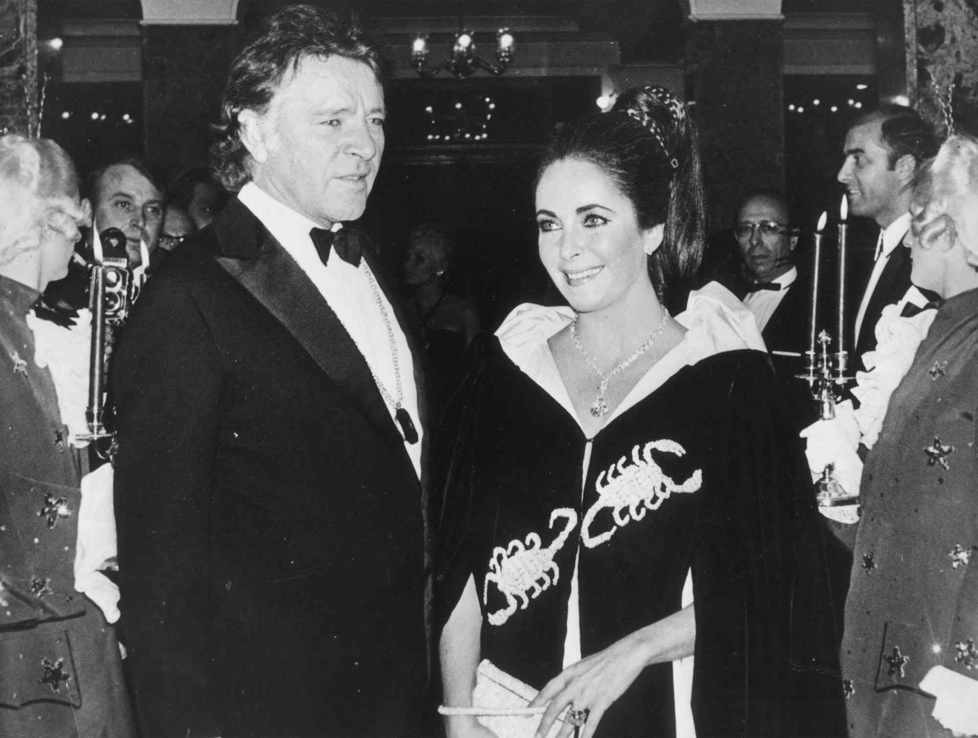 Richard Burton and Elizabeth Taylor arrive at Hotel Hermitage for the Scorpion-Ball in Monaco, Nov. 15, 1969. Princess Grace of Monaco invited the couple along with numerous other guests for the celebration of her 40th birthday. Taylor is wearing a Cartier diamond of almost 70 carats, which she recently bought at Cartier, New York