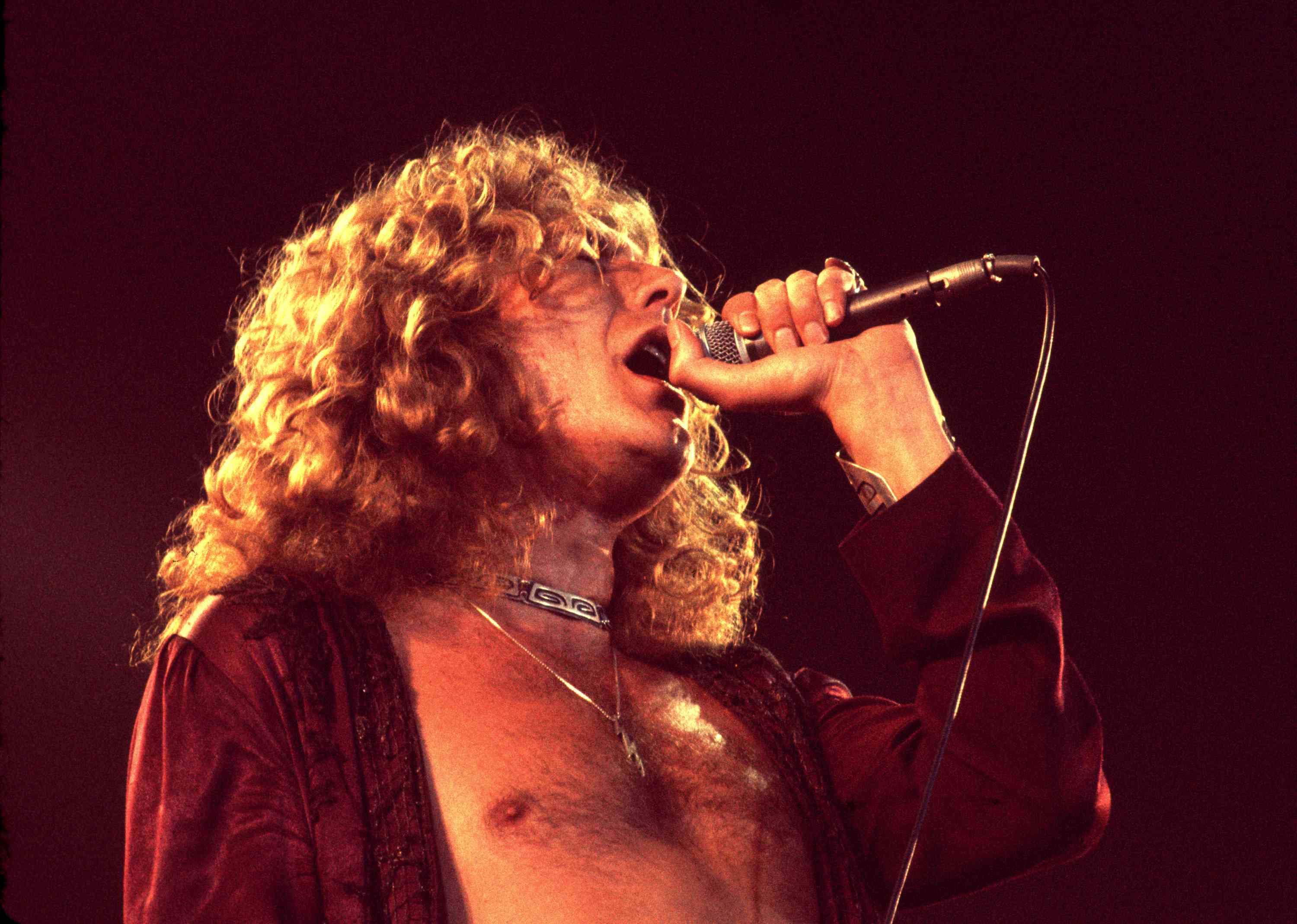 Robert Plant sings with Led Zeppelin in 1977 in Los Angeles, London.