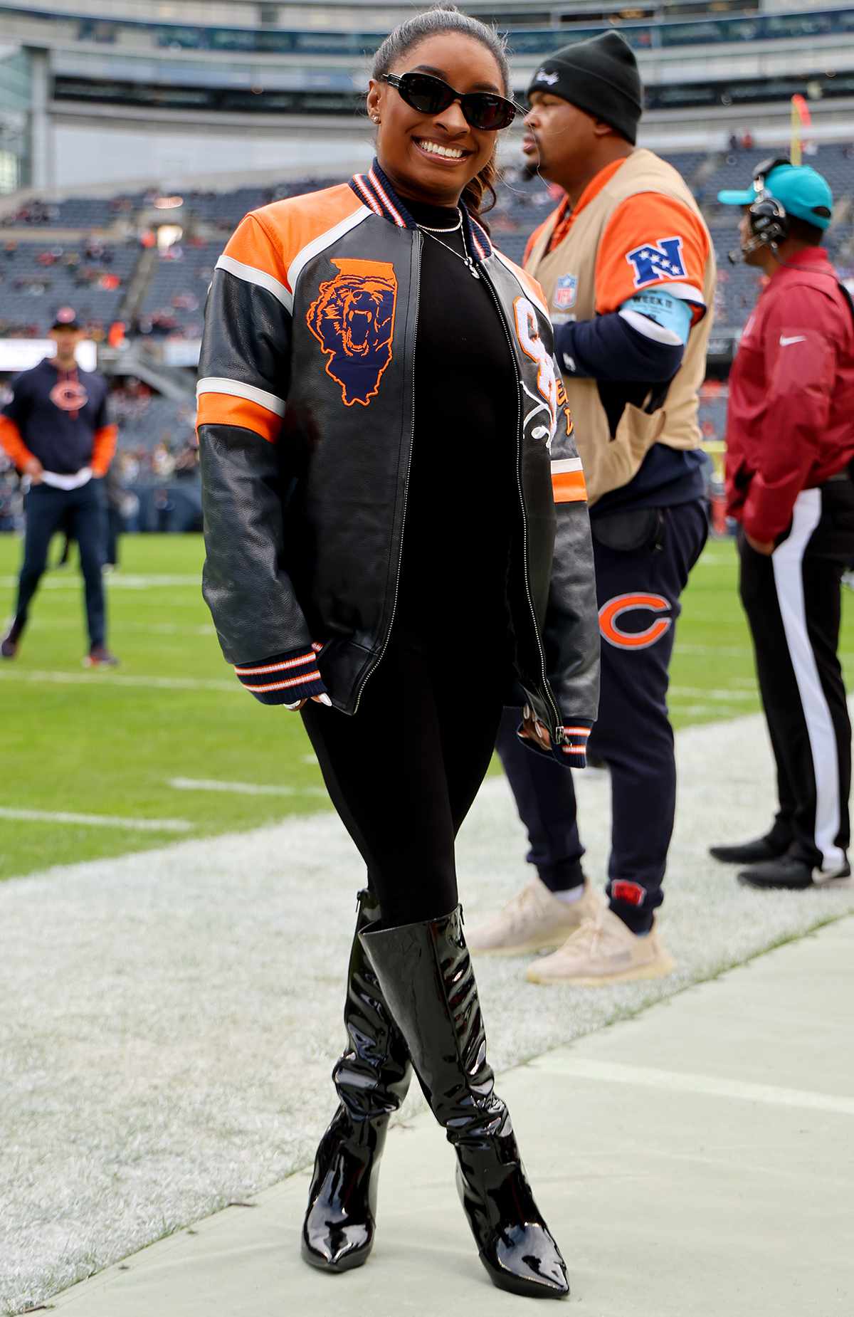 Simone Biles poses for a photo prior to a game between the Chicago Bears and the Green Bay Packers at Soldier Field