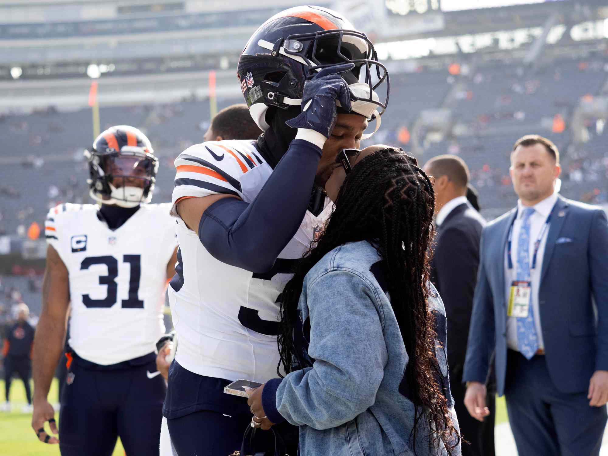  Team USA Olympic Gymnastics Gold Medalist Simone Biles kisses her husband Chicago Bears safety Jonathan Owens (36) before a regular season game between the Minnesota Vikings and the Chicago Bears on November 24, 2024, at Soldier Field in Chicago, Illinois.