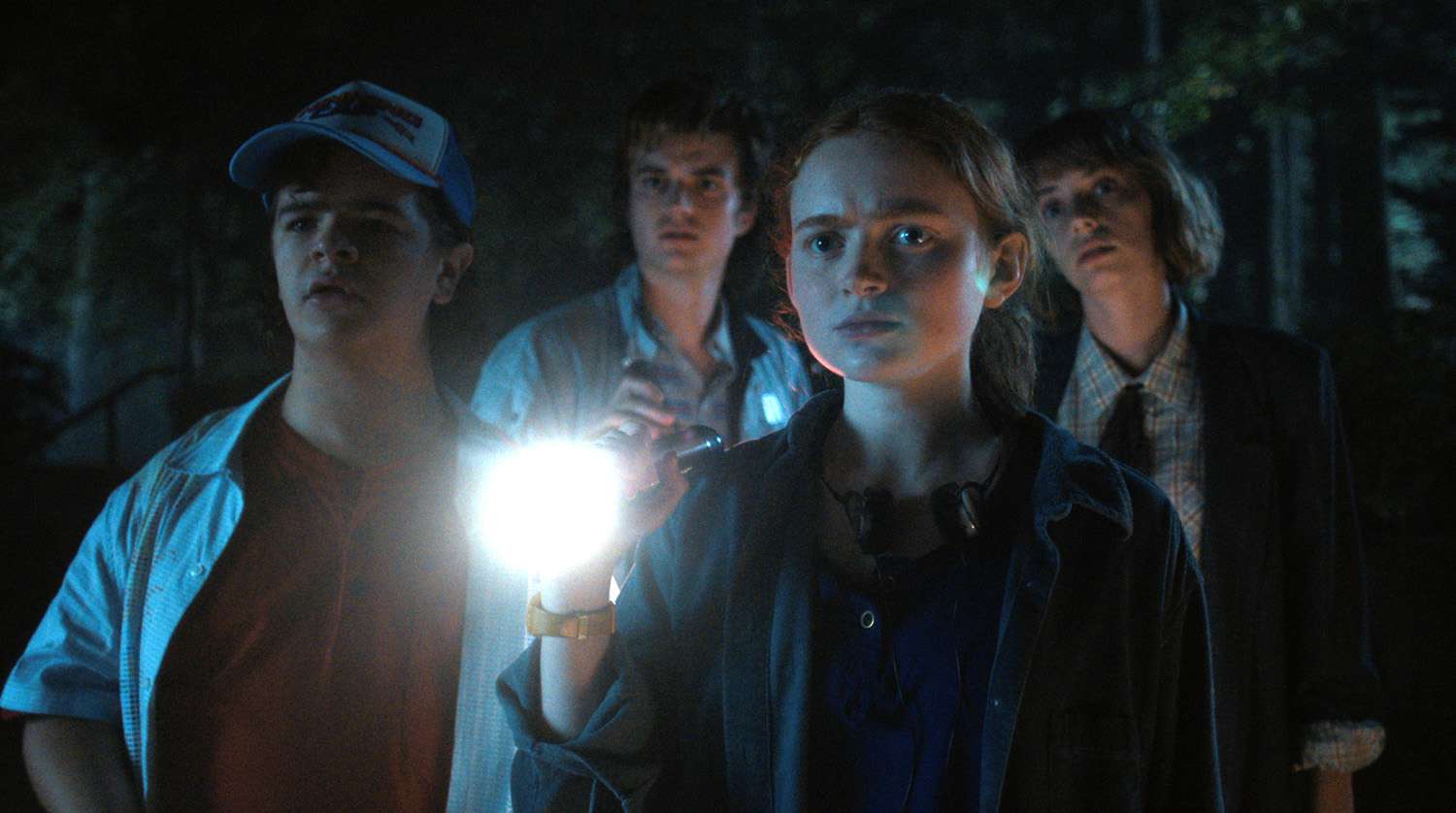 Gaten Matarazzo as Dustin Henderson, Joe Keery as Steve Harrington, Sadie Sink as Max Mayfield, and Maya Hawke as Robin Buckley in STRANGER THINGS.