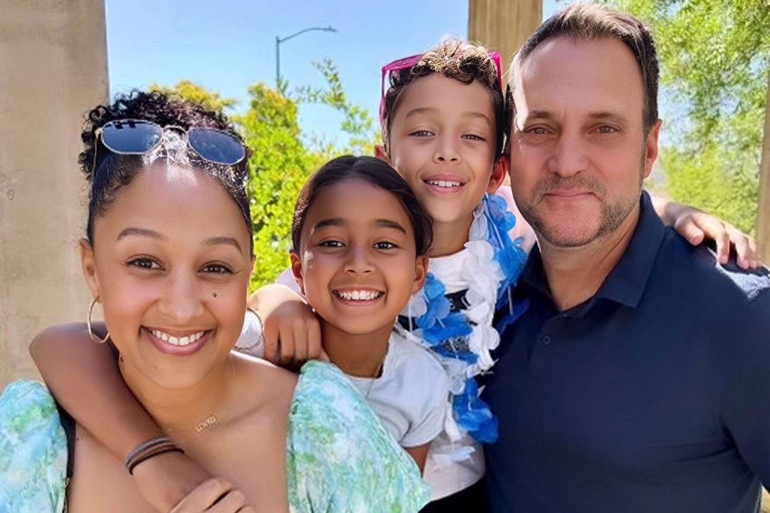 Tamera Mowry with her husband Adam Housley and two children