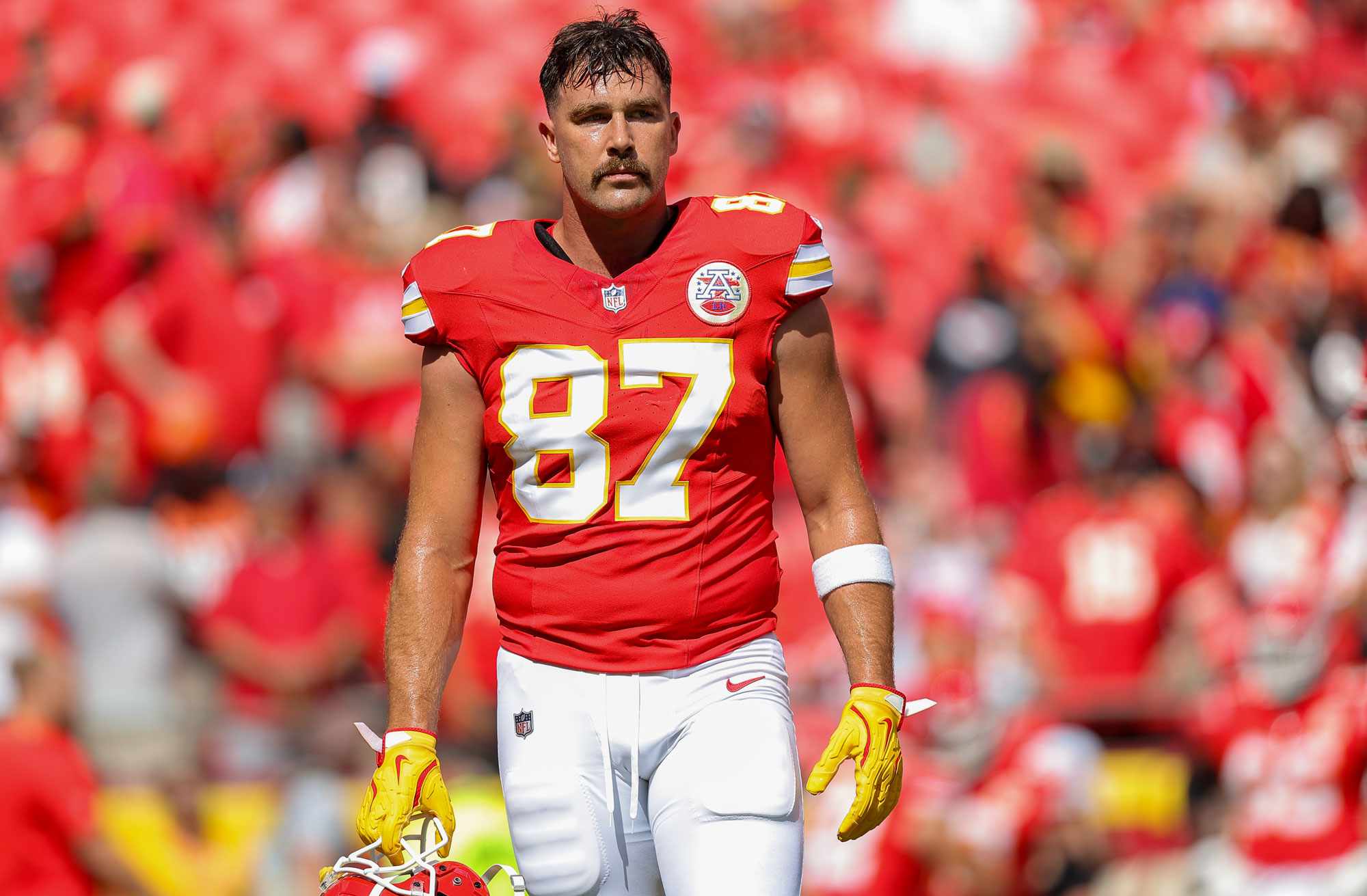 Travis Kelce 87 of the Kansas City Chiefs walks the field during pregame warmups prior to the regular season game against the Cincinnati Bengals at GEHA Field at Arrowhead Stadium on September 15, 2024