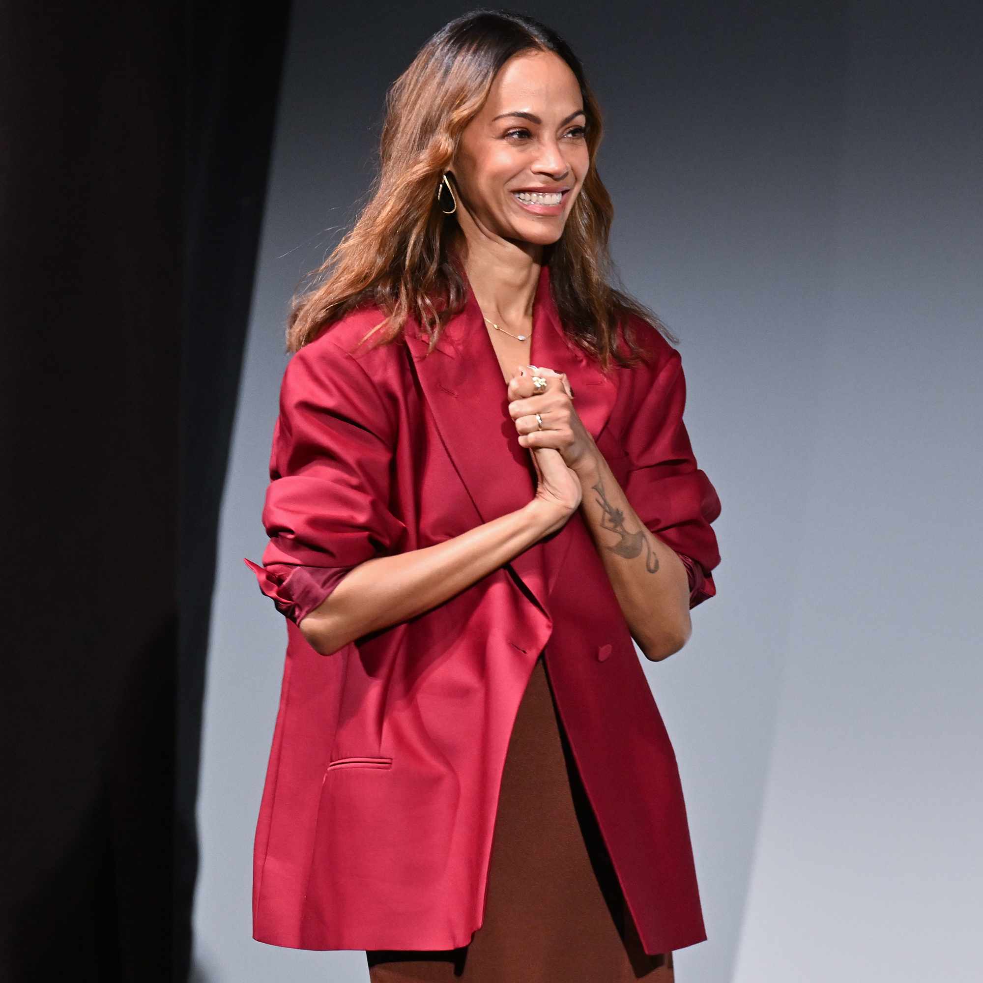 Honoree Zoe Saldana arrives onstage during her Vanguard Award Presentation during the SCAD Savannah Film Festival on November 01, 2024 in Savannah, Georgia. 