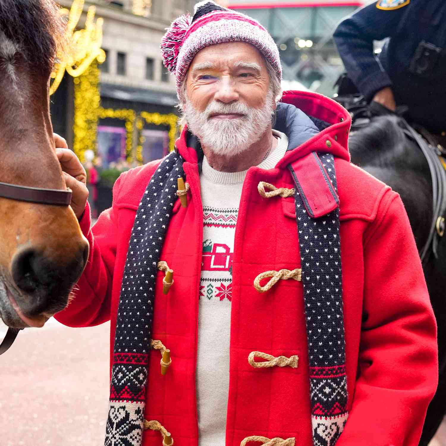 Arnold Schwarzenegger greets NYPD horses in between filming in New York City.