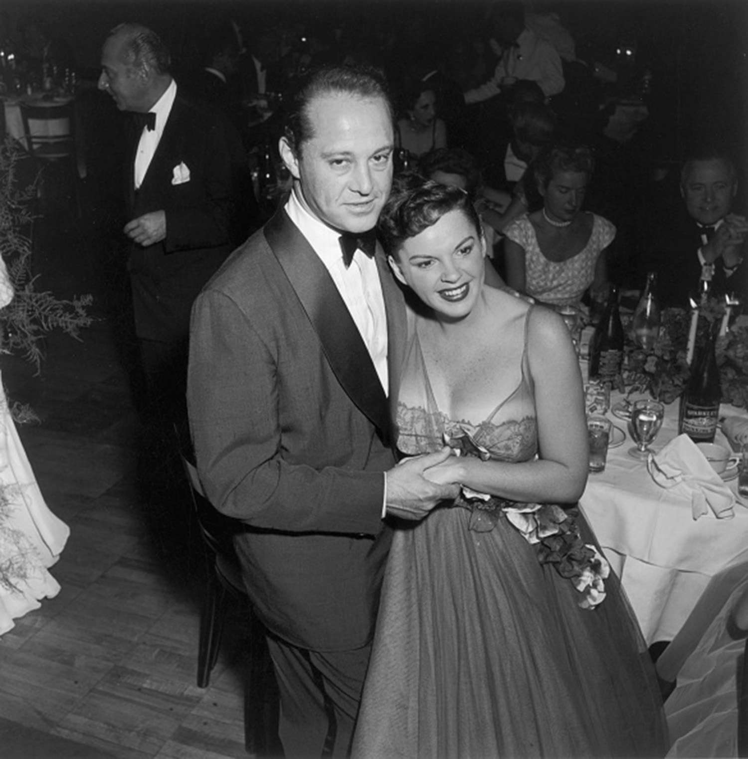 Actress Judy Garland and her husband, producer Sid Luft, at a party held at Romanoff's restaurant following the opening of her show with the Los Angeles Philharmonic, Hollywood, California in 1954.