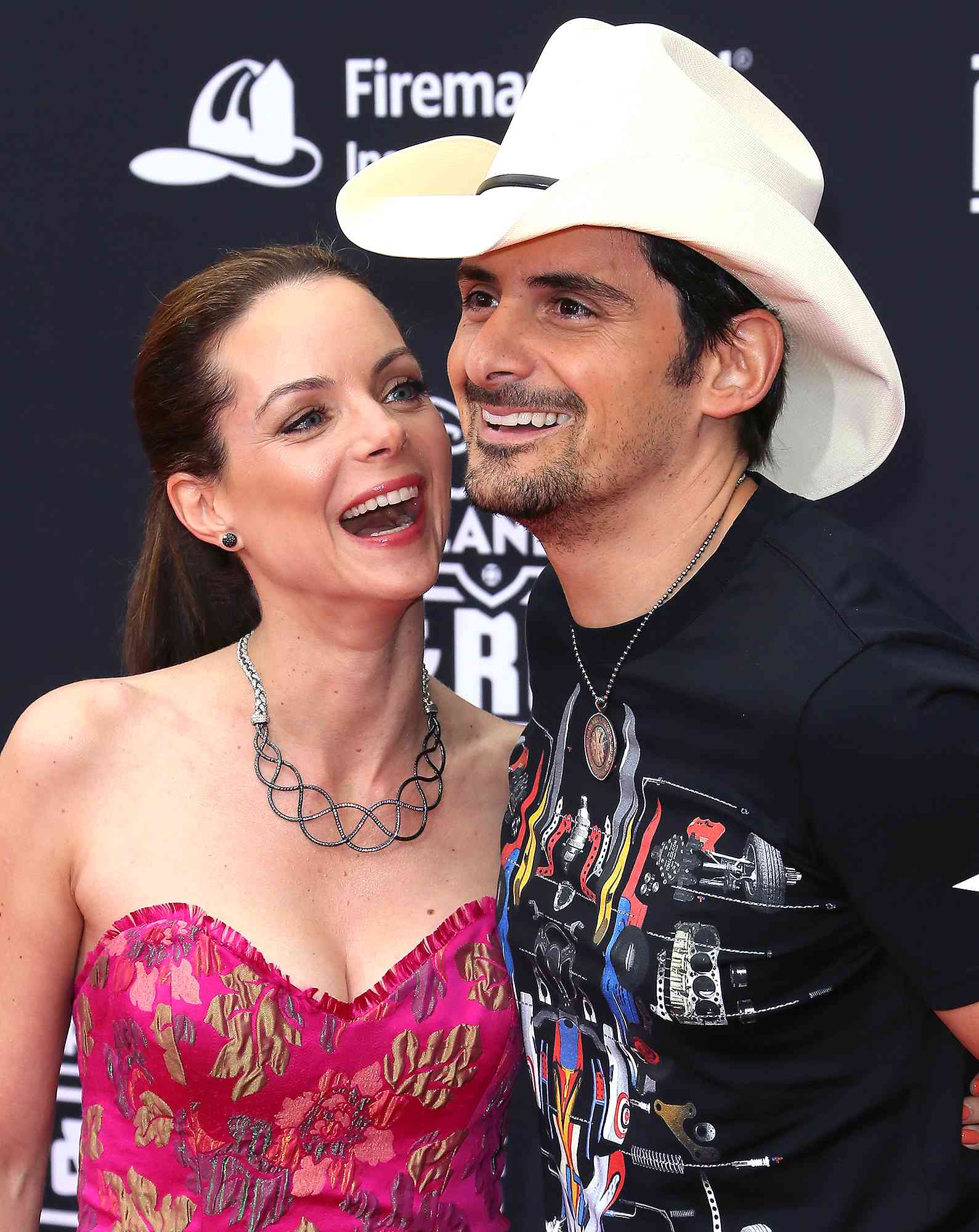 Actress Kimberly Williams-Paisley (L) and husband singer Brad Paisley attend the premiere of Disney's "Planes: Fire & Rescue" 