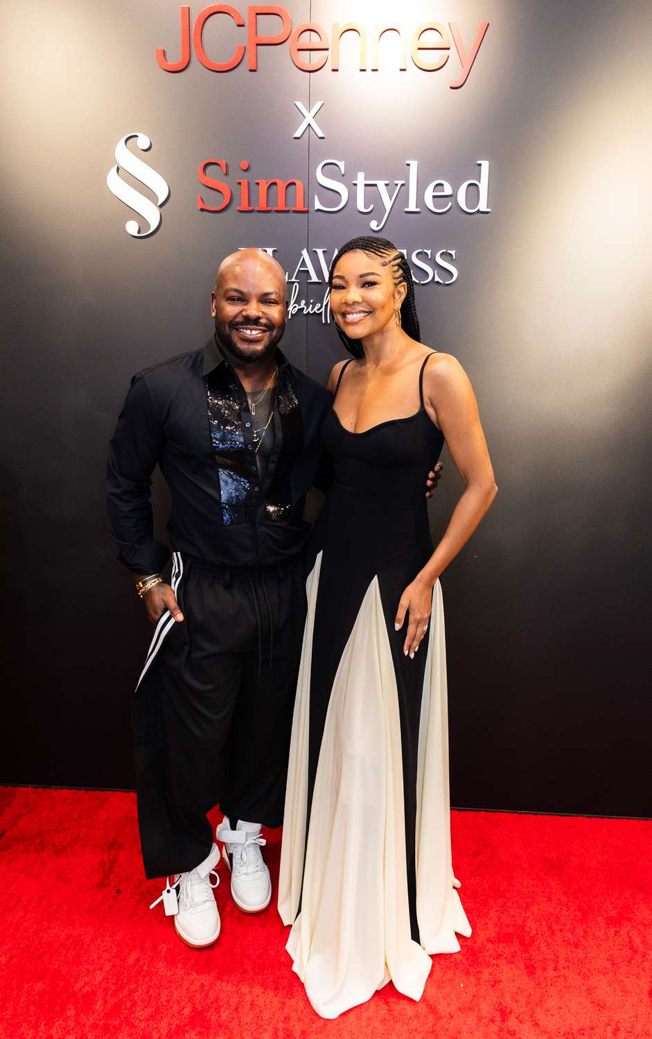 Larry Sims and Gabrielle Union celebrate the launch of SimStyled at the Glendale Galleria JCPenney on Tuesday, Dec. 3, 2024 in Los Angeles. 