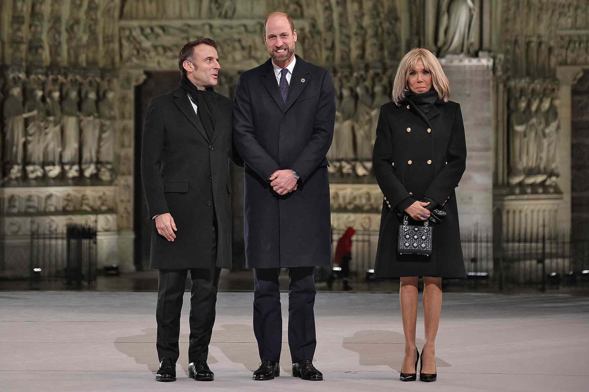 French President Emmanuel Macron (L) and his wife Brigitte (R) welcome Britain's William, Prince of Wales head of a ceremony to mark the re-opening of the landmark Notre-Dame Cathedral in central Paris on December 7, 2024. Around 50 heads of state and government are expected in the French capital to attend the ceremony marking the rebuilding of the Gothic masterpiece five years after the 2019 fire which ravaged the world heritage landmark and toppled its spire. Some 250 companies and hundreds of experts were part of the five-year restoration project at a cost of hundreds of millions of euros. 