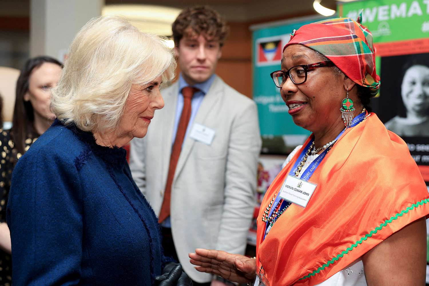 Queen Camilla (L) speaks with a guest during a reception at Waltham Forest Town Hall in London on December 20, 2024.