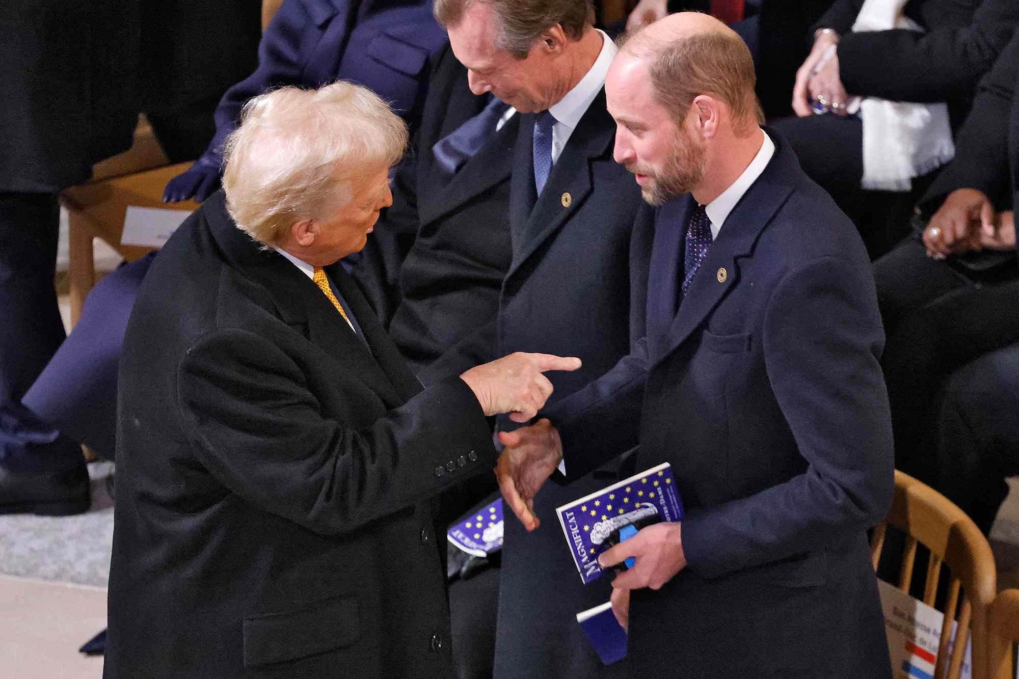 US President-elect Donald Trump (L) gestures as he talks with Britain's Prince William, Prince of Wales (R) inside Notre-Dame Cathedral ahead of a ceremony to mark the re-opening of the landmark cathedral, in central Paris, on December 7, 2024. Around 50 heads of state and government are expected in the French capital to attend the ceremony marking the rebuilding of the Gothic masterpiece five years after the 2019 fire which ravaged the world heritage landmark and toppled its spire. Some 250 companies and hundreds of experts were part of the five-year restoration project at a cost of hundreds of millions of euros