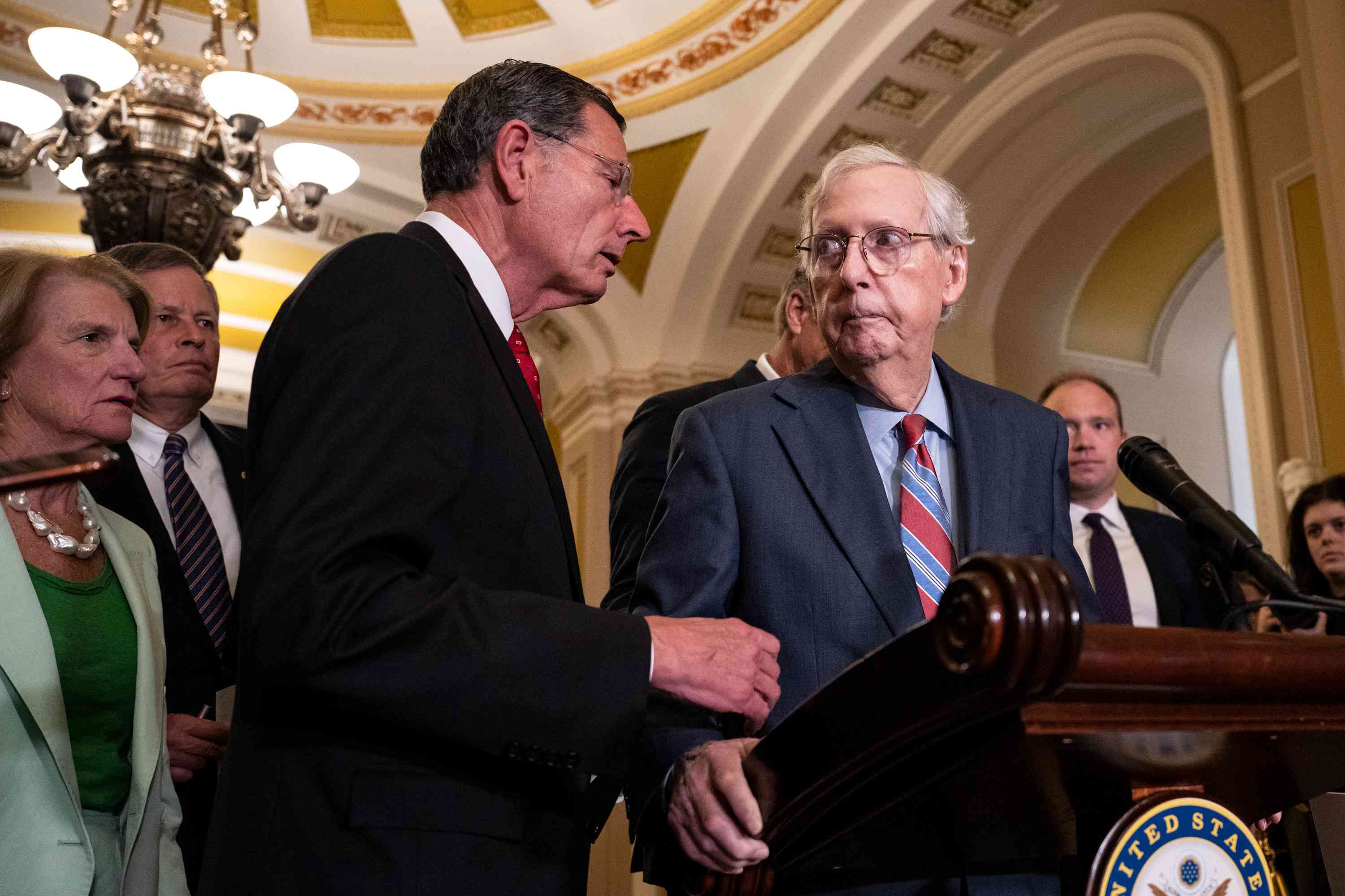 Senate Minority Leader Mitch McConnell arrives to a news conference after a lunch meeting with Senate Republicans