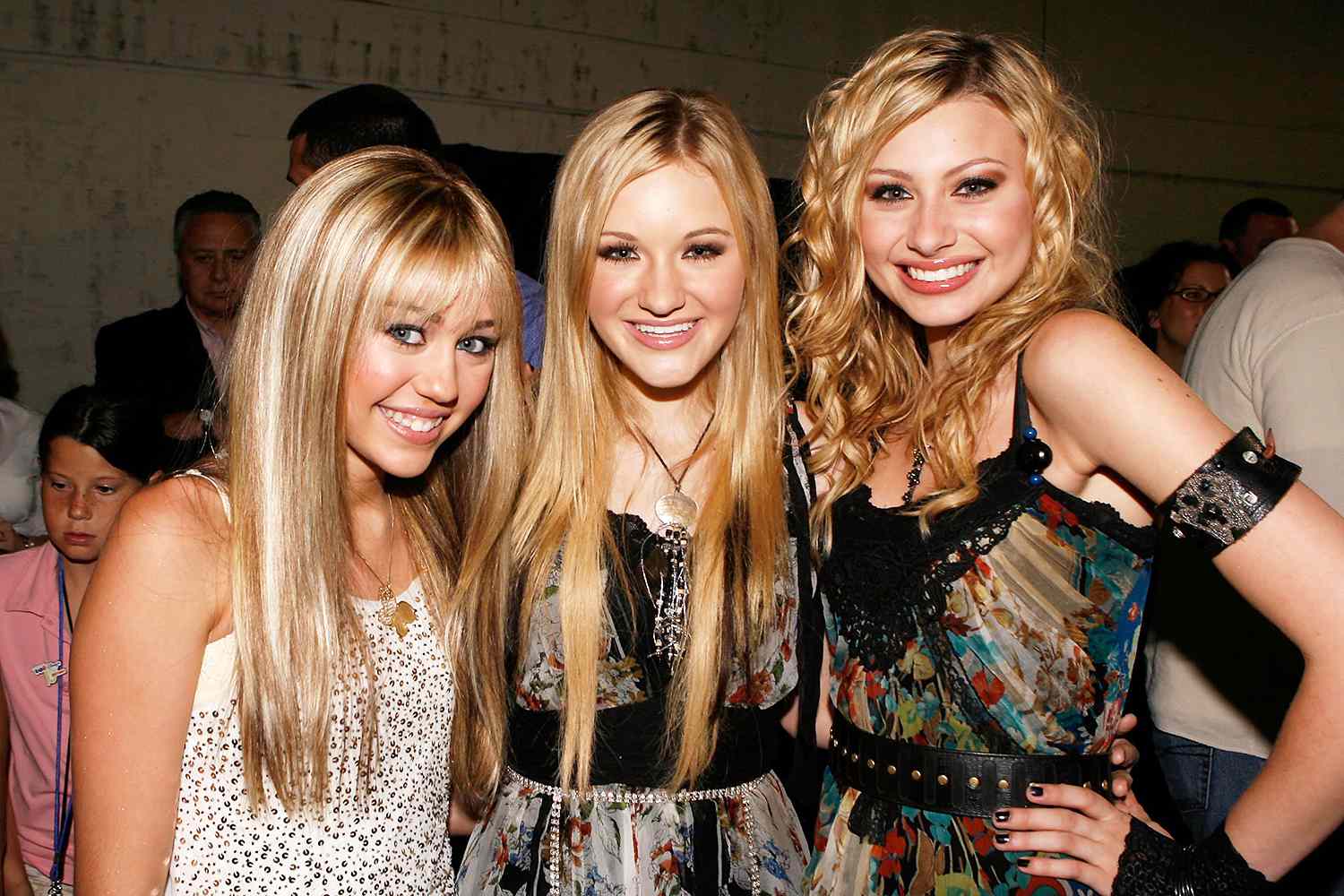 (L-R) Singers Miley Cyrus, AJ Michalka and Aly Michalka pose backstage at the Radio Disney Totally 10 Birthday Concert held at the Arrowhead Pond of Anaheim on July 22, 2006 in Anaheim, California.