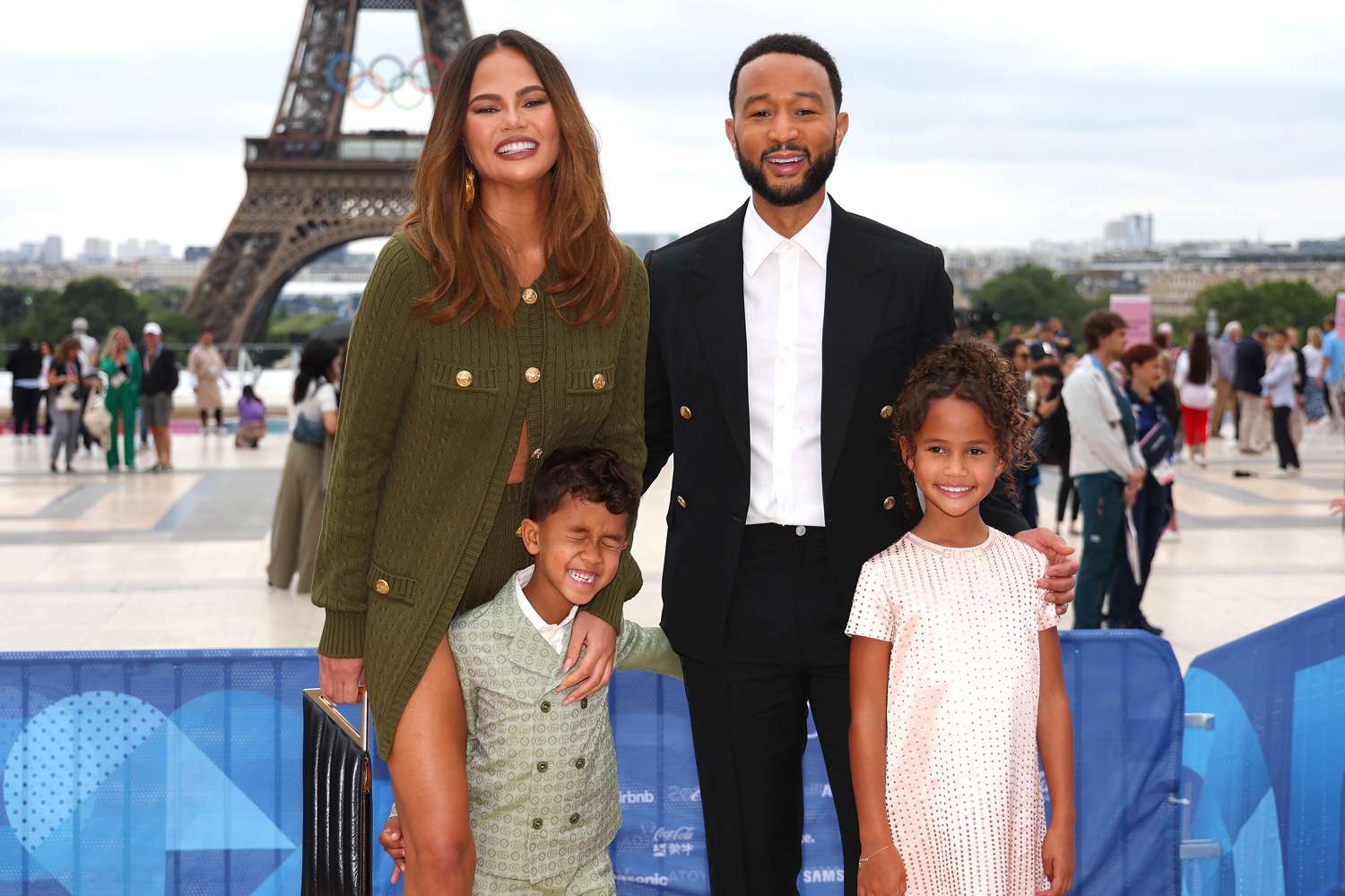 Chrissy Teigen and John Legend attend with son Miles and daughter Luna the red carpet ahead of the opening ceremony of the Olympic Games Paris 2024 on July 26, 2024 in Paris, France