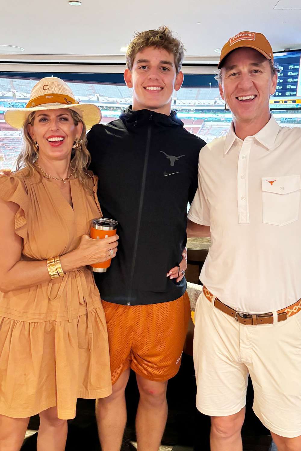 Cooper Manning and Ellen Manning with their son Arch at a university of Tennessee football game.