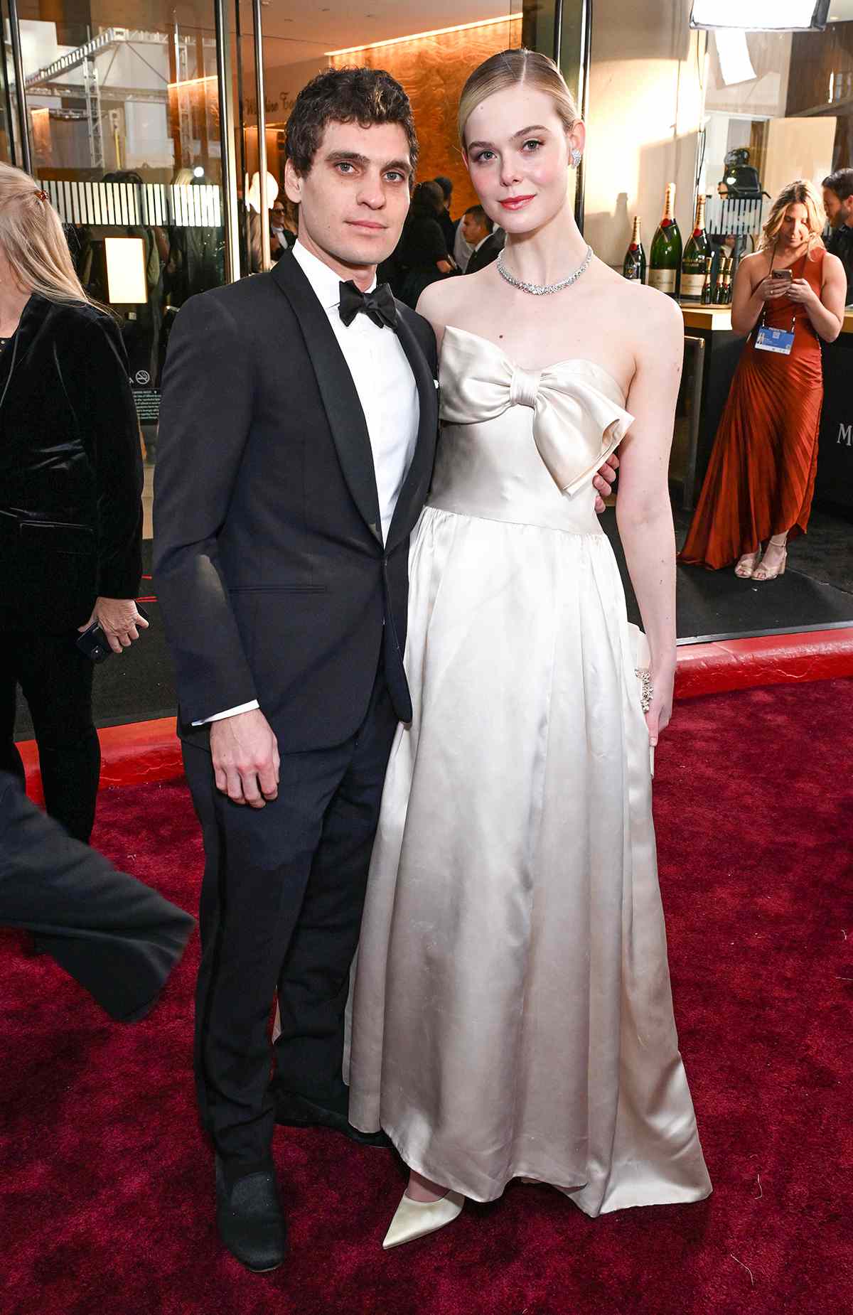 (L-R) Gus Wenner and Elle Fanning at The 81st Annual Golden Globe Awards with MoÃ«t & Chandon, Celebrating the 13th Year of Toast for a Cause at the Beverly Hilton on January 7, 2023