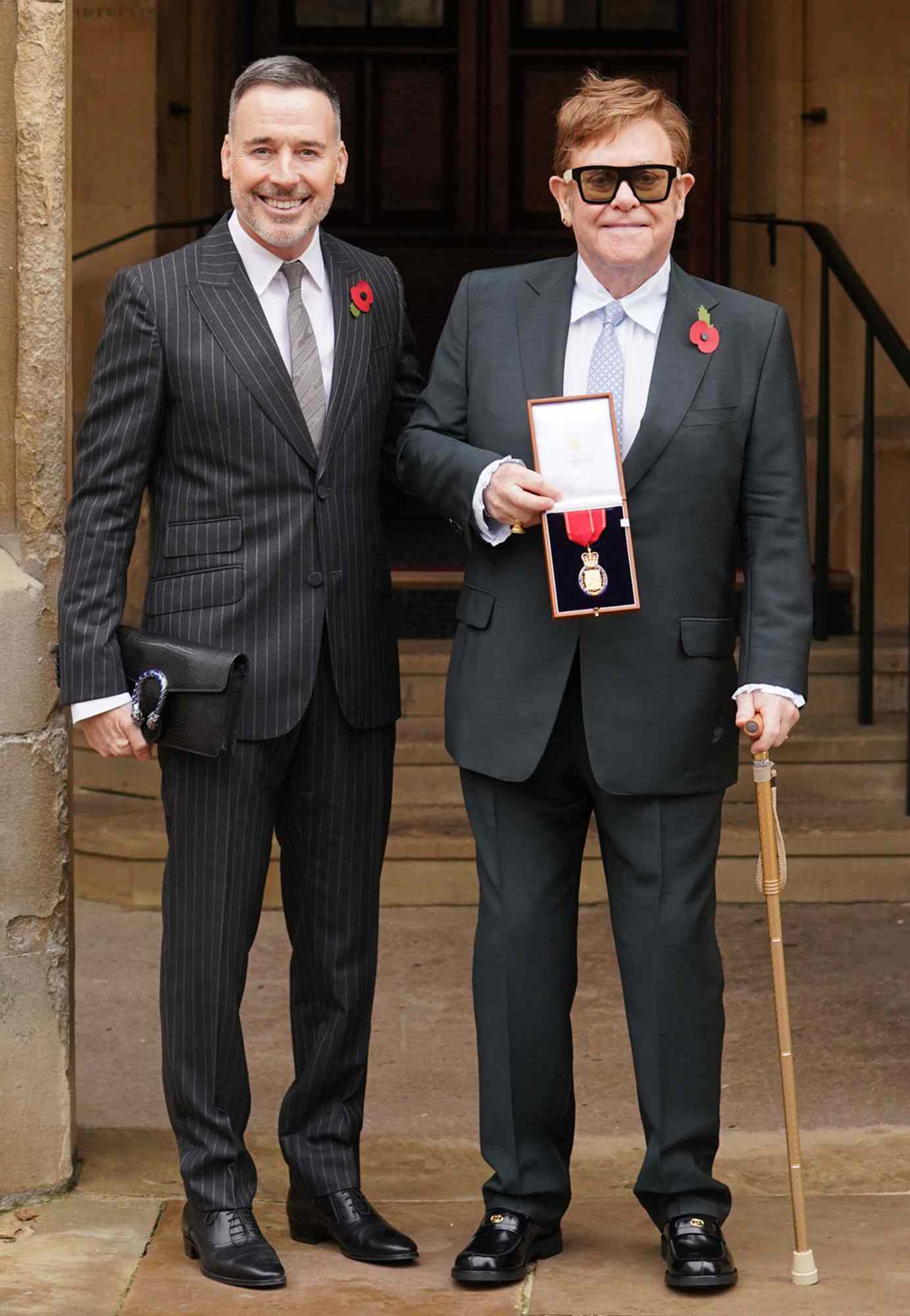 Sir Elton John, with his partner David Furnish at Windsor Castle on November 10, 2021 in Windsor, England