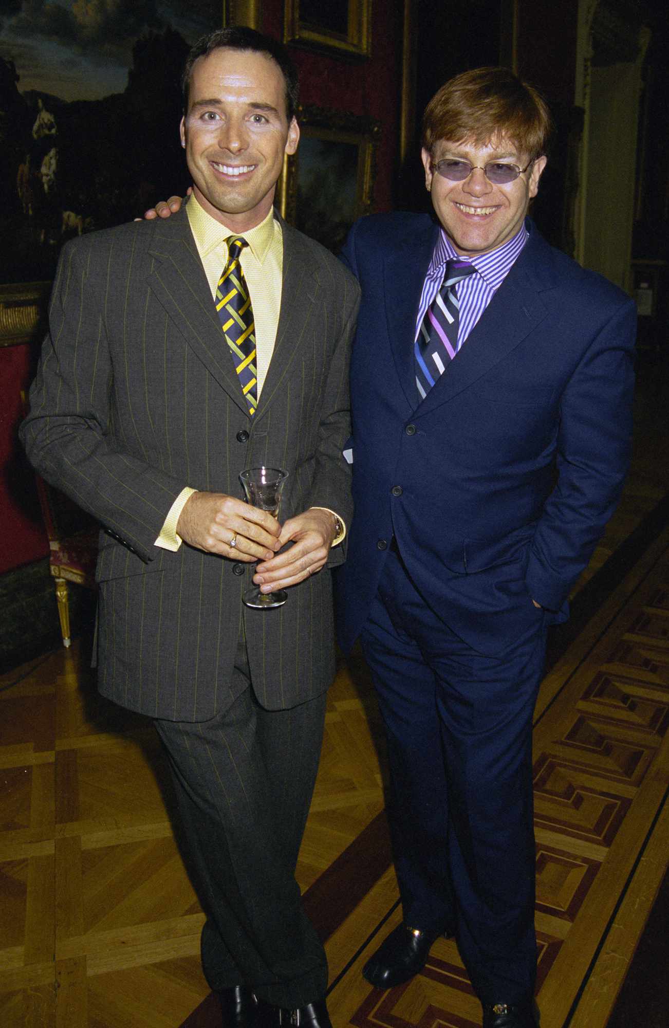 Elton John and his partner David Furnish attend Lord Linley's furniture launch at the Wallace Collection in London, 26th June 1997