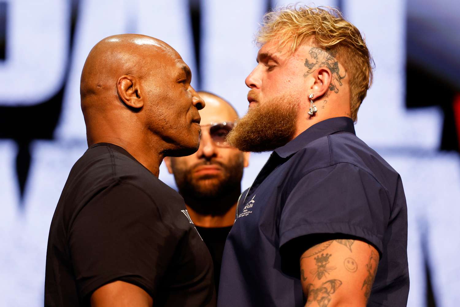 Mike Tyson and Jake Paul speak onstage at the press conference in promotion for the upcoming Jake Paul vs. Mike Tyson boxing match at The Apollo Theater on May 13, 2024 in New York City.