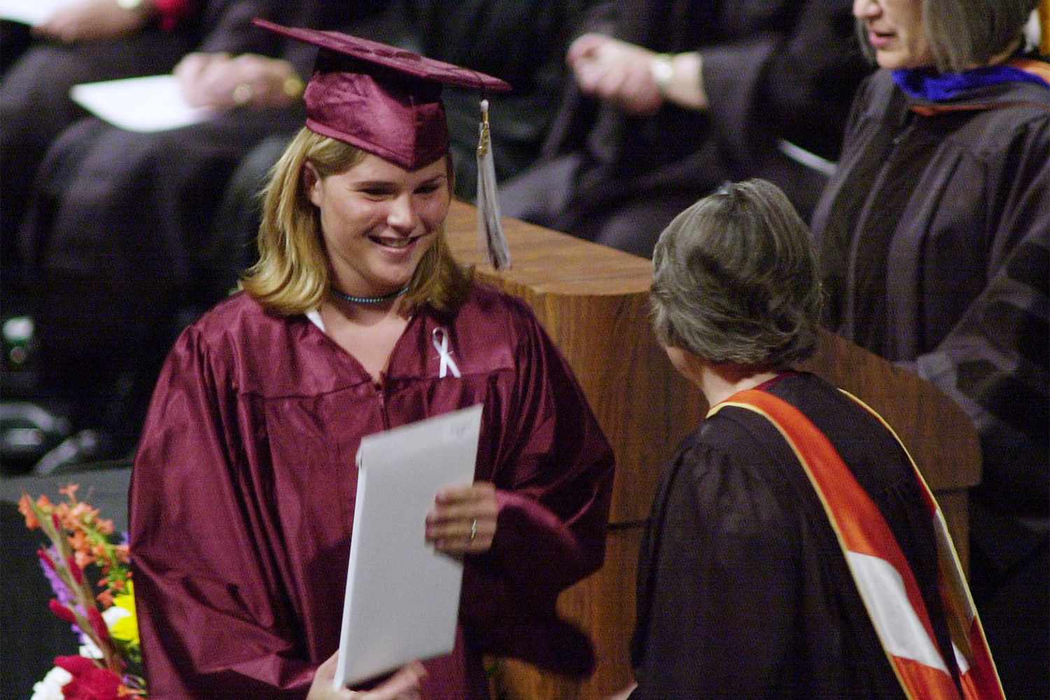 Jenna Welch Bush, daughter of Presidential candidate George W. Bush, receiving her high school diploma.