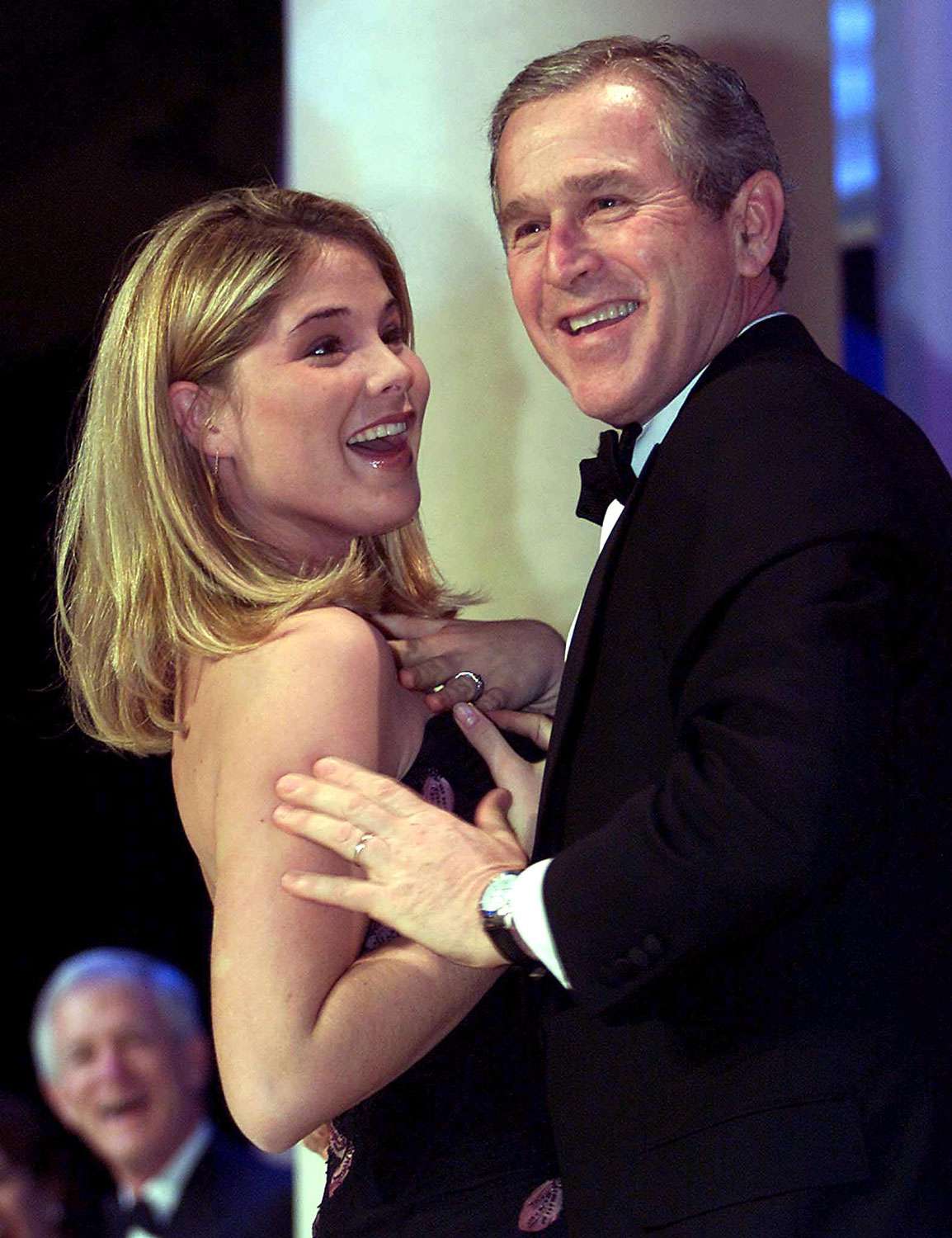 US President George W. Bush (R) dances with his daughter Jenna at the Inaugural Ball at the Pension Building in Washington, DC, 20 January, 2001