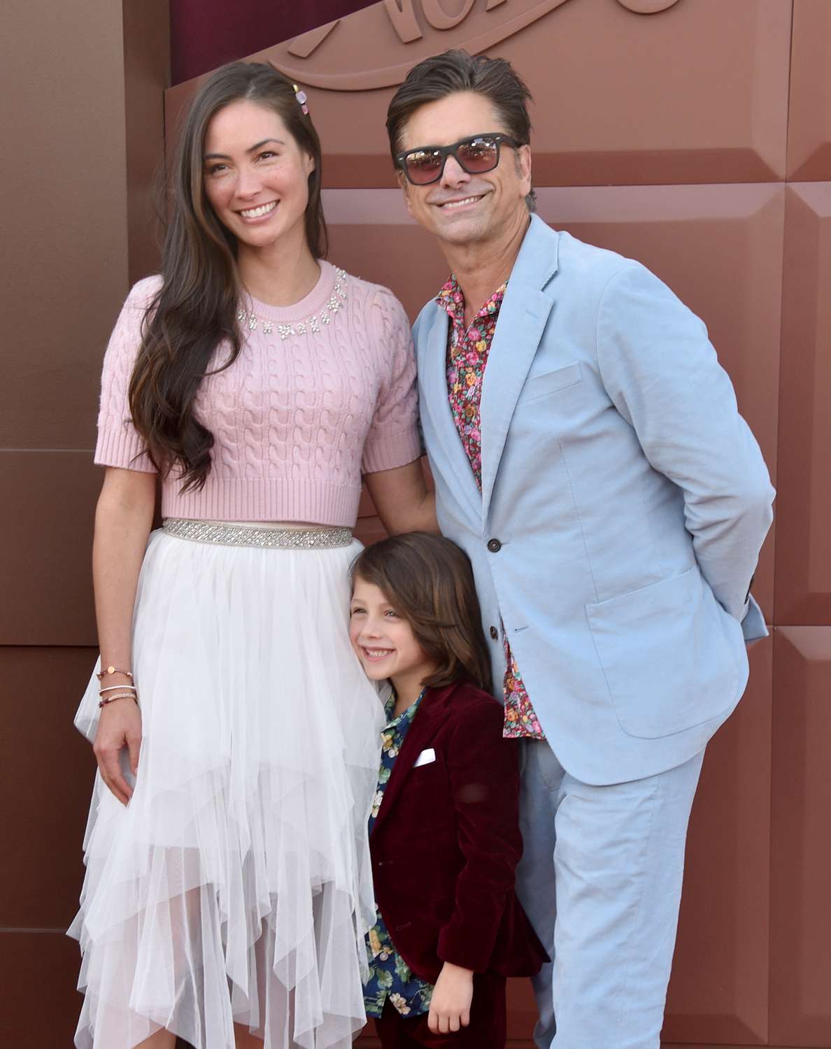 Caitlin McHugh, Billy Stamos, and John Stamos attend the Los Angeles Premiere Of Warner Bros. "Wonka" at Regency Village Theatre on December 10, 2023 in Los Angeles, California