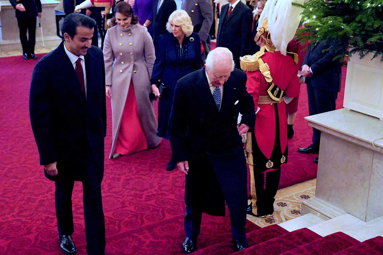 Britain's King Charles III and Qatar's Emir Sheikh Tamim bin Hamad al-Thani walk ahead of Britain's Queen Camilla and Sheikha Jawaher bint Hamad bin Suhaim al-Thani after they arrived at Buckingham Palace in London