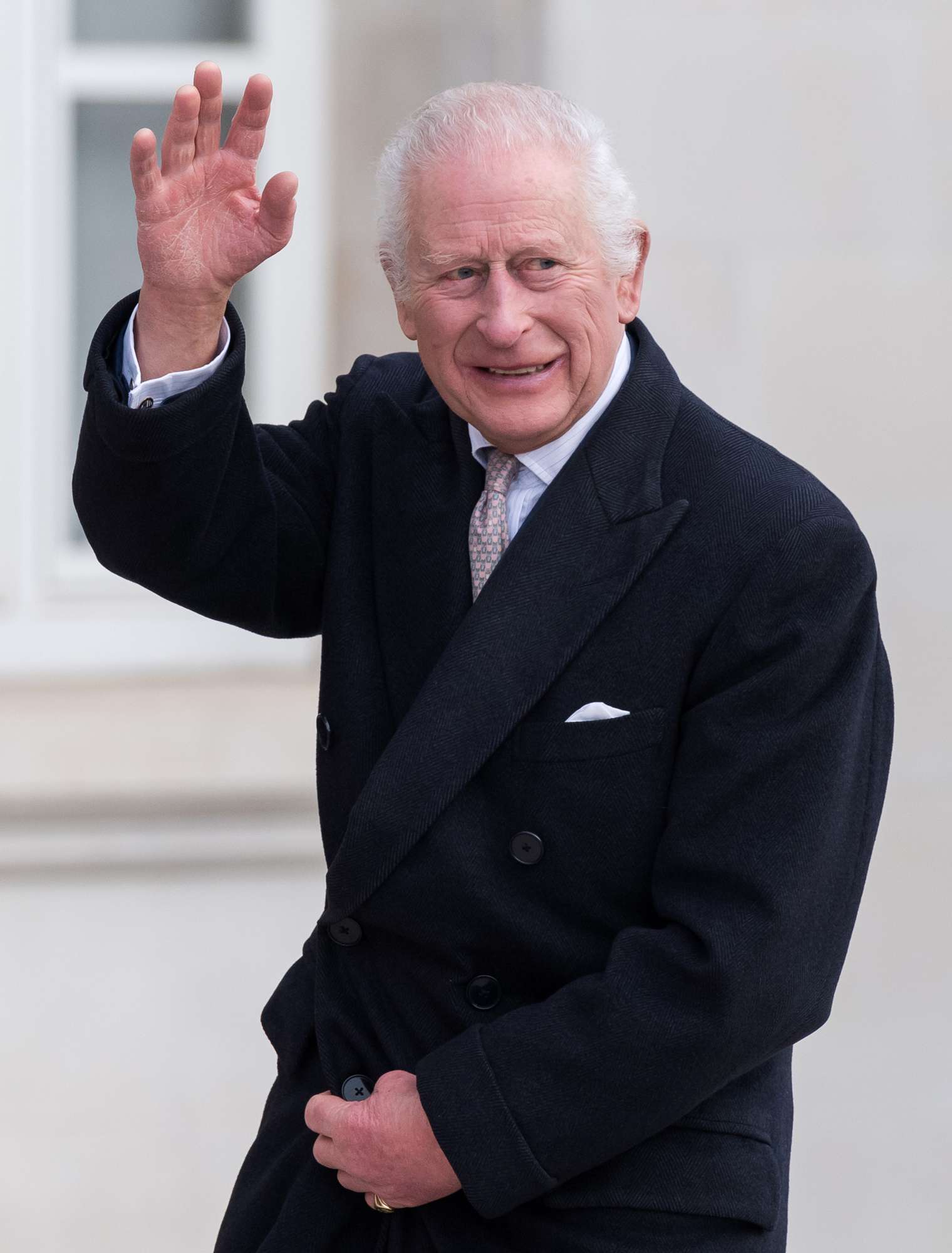 King Charles III waves towards well-wishers as he arrives in Fellowship Square to attend a reception at Waltham Forest Town Hall to celebrate the cohesion of the borough's community, highlighted by huge anti-racism protest in August 2024, when tens of thousands of people gathered to counter far-right rallies and demonstrate against the right-wing violence in other parts of the UK in London, United Kingdom on December 20, 2024. 