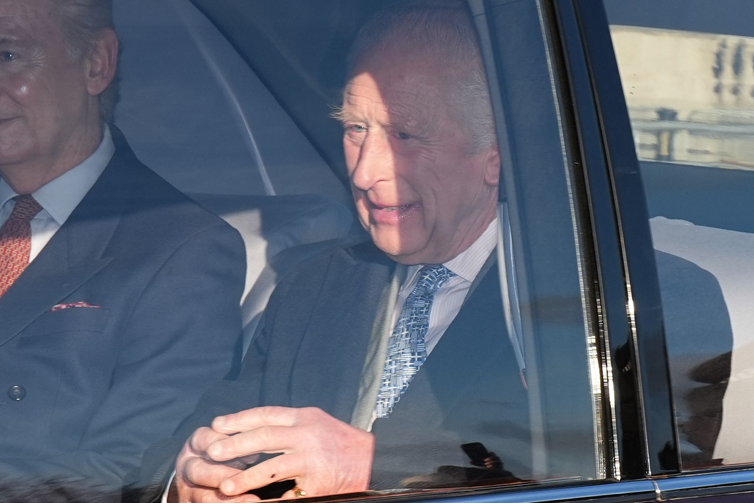 King Charles III and his private secretary Sir Clive Alderton arriving for the King's Christmas lunch at Buckingham Palace