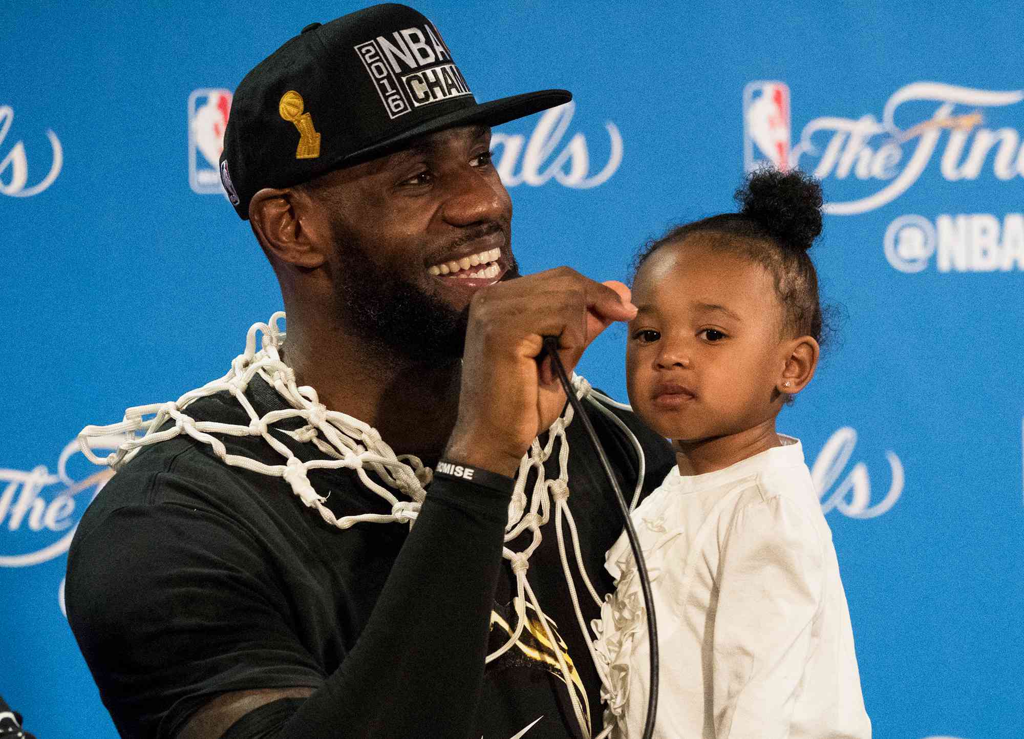 LeBron James with daughter Zhuri during press conference after winning series vs Golden State Warriors at Oracle Arena on June 19, 2016.