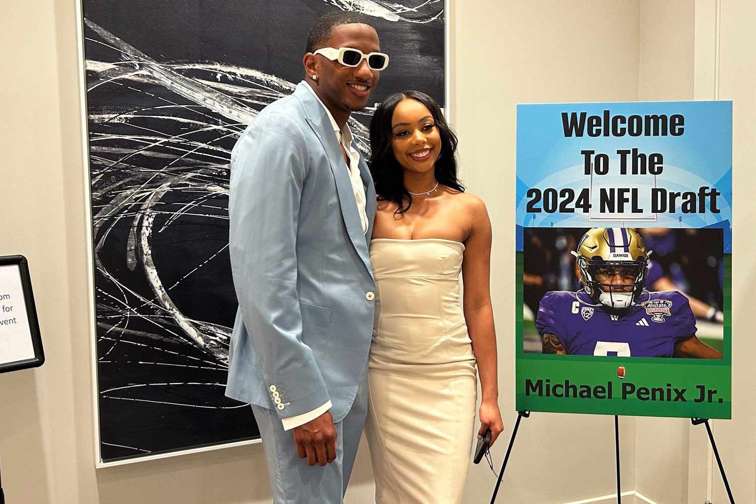 Michael Penix Jr. and his girlfriend Olivia Carter pose for photos at Penix Jr.'s NFL draft party on April 5, 2024, in St. Petersburg, Fla.