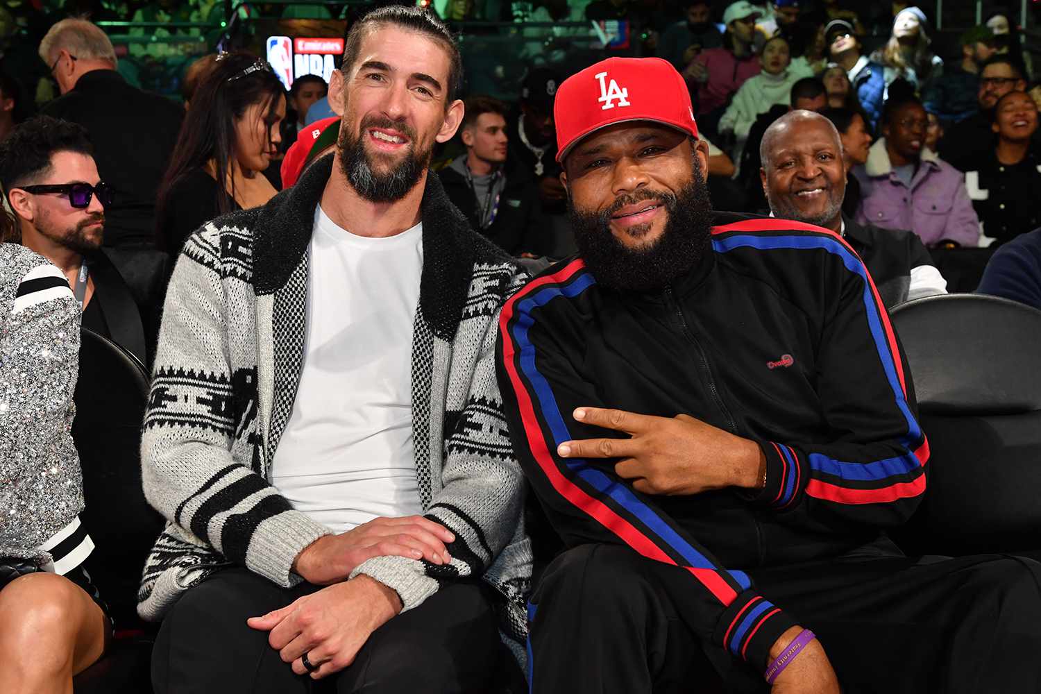 Michael Phelps and Anthony Anderson poses for a photo during the game between the Milwaukee Bucks and the Oklahoma City Thunder during the Emirates NBA Cup Championship game 