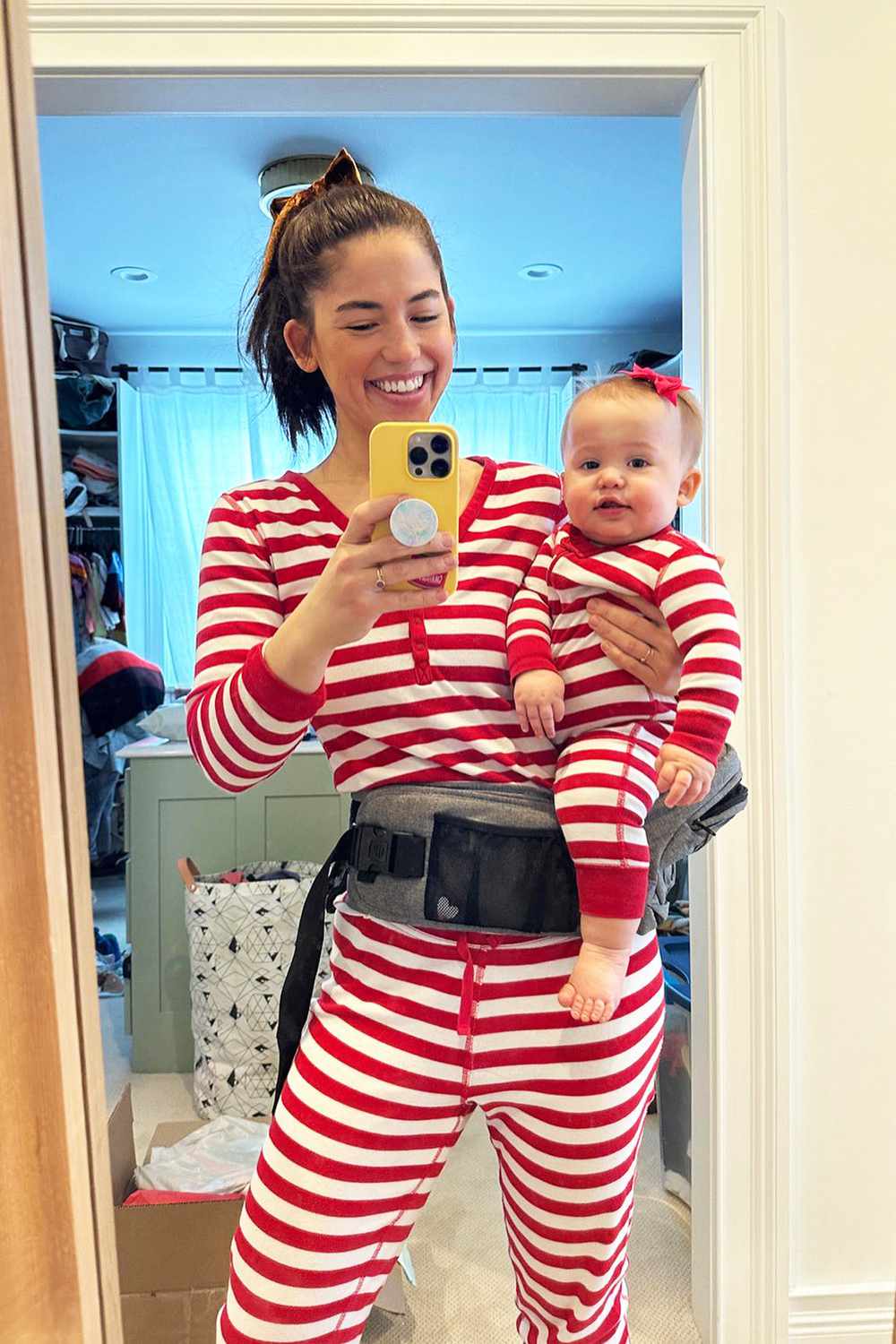 Molly Yeh takes a mirror selfie with daughter Ira.