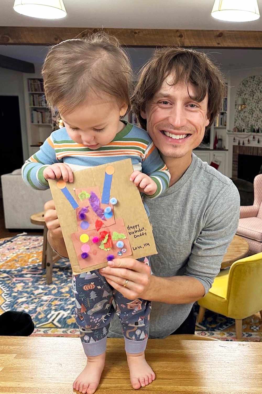 Molly Yeh's husband Nick Hagen smiles with daughter Ira.