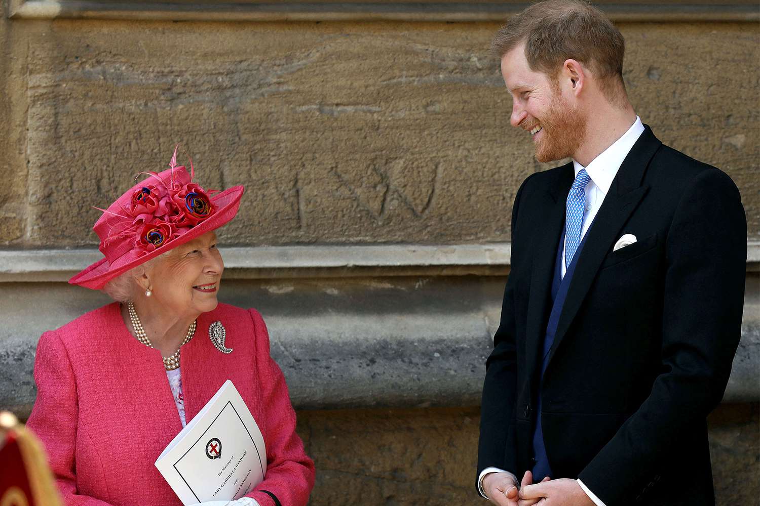 Queen Elizabeth II (L) and Britain's Prince Harry, Duke of Sussex, leave St George's Chapel in Windsor Castle, Windsor