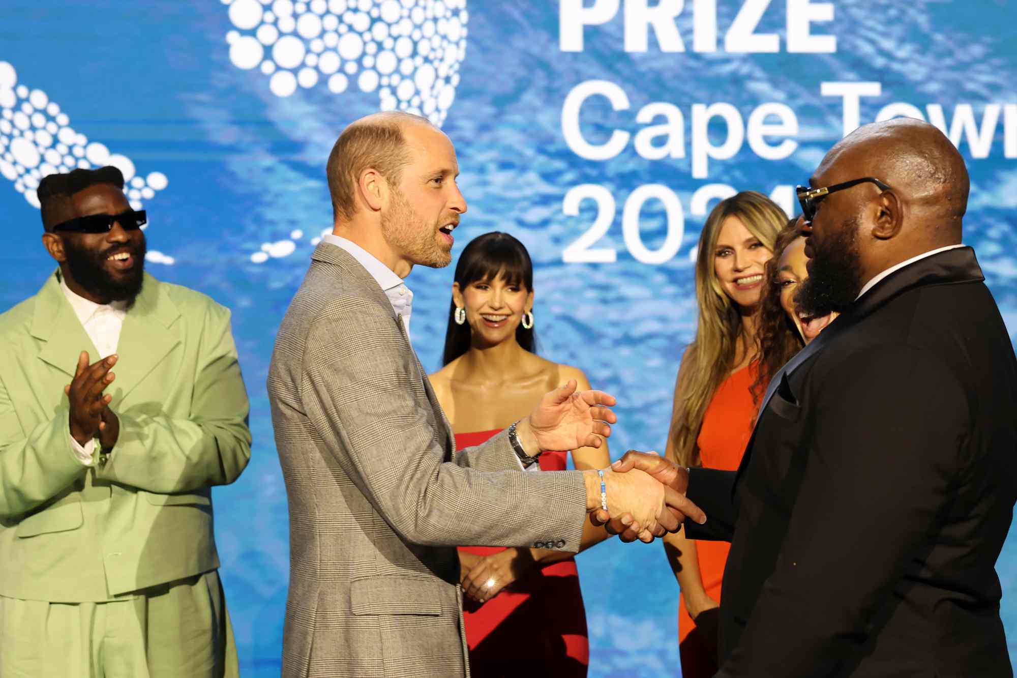 Britain's Prince William, Prince of Wales poses with performers and presenters during the 2024 Earthshot Prize awards ceremony on November 6, 2024 in Cape Town, South Africa. During his visit, The Prince of Wales attended the fourth annual Earthshot Prize Awards and engaged in various environmental initiatives and participated in events held in Cape Town as part of 'Earthshot Week'.