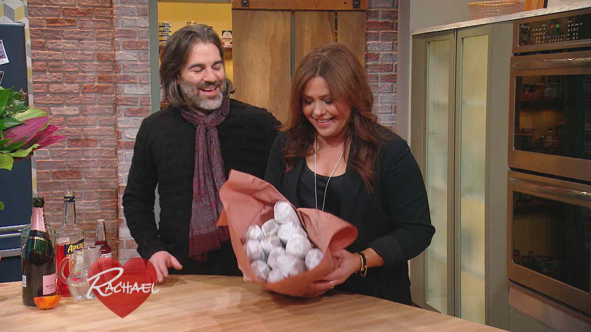 Rachael Ray's husband John Cusimano presents her with a salami bouquet for Valentine's Day.