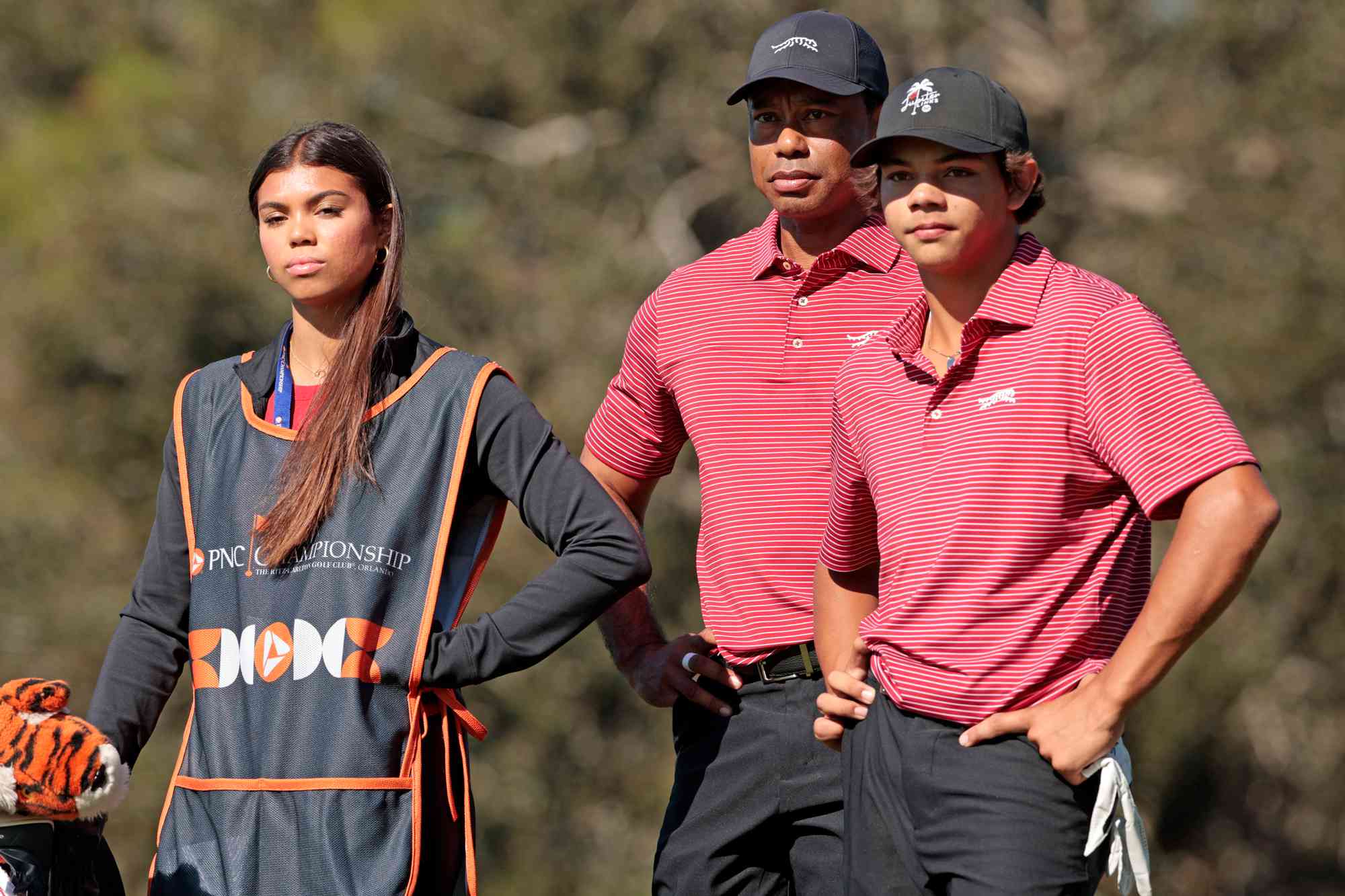 Tiger Woods of the United States with his son Charlie Woods and daughter Sam Woods prepare to tee off from the second tee during the second round of the PNC Championship at Ritz-Carlton Golf Club on December 22, 2024 in Orlando, Florida. 