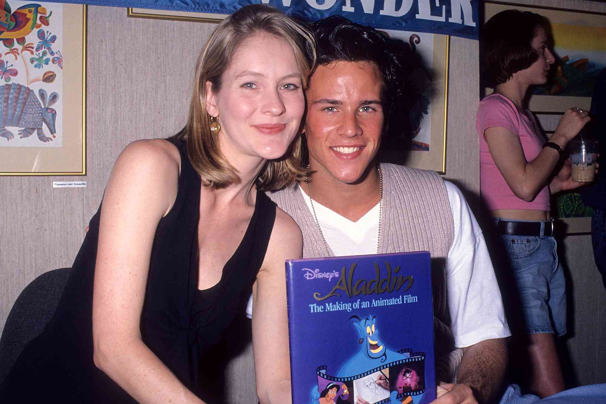 Actress Linda Larkin and actor Scott Weinger autograph copies of the classic children's book "Aladdin" on April 10, 1993 at Books of Wonder in Beverly Hills, California. 