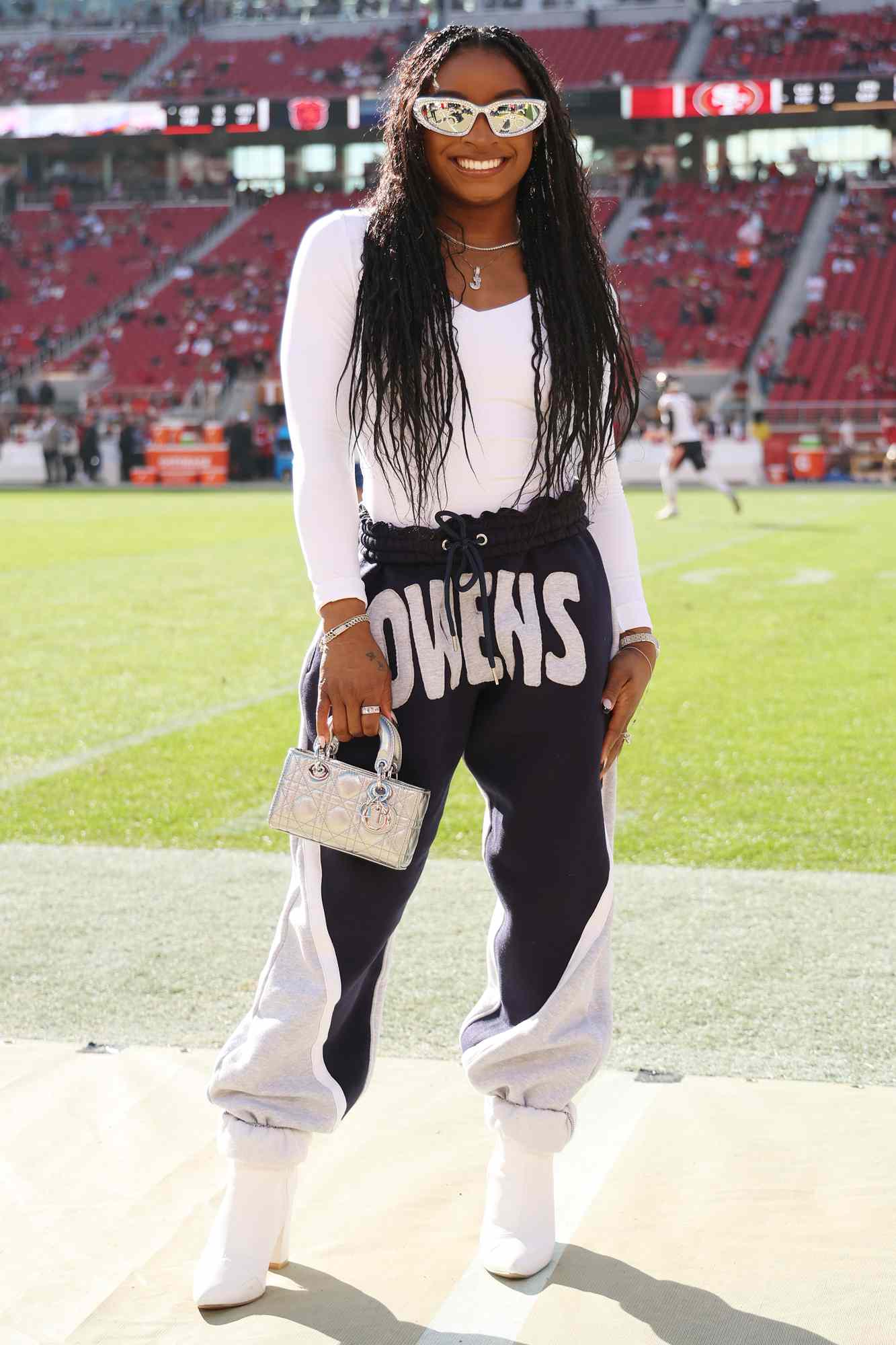 Gymnast Simone Biles looks on prior to a game between the Chicago Bears and the San Francisco 49ers at Levi's Stadium on December 08, 2024 in Santa Clara, California.