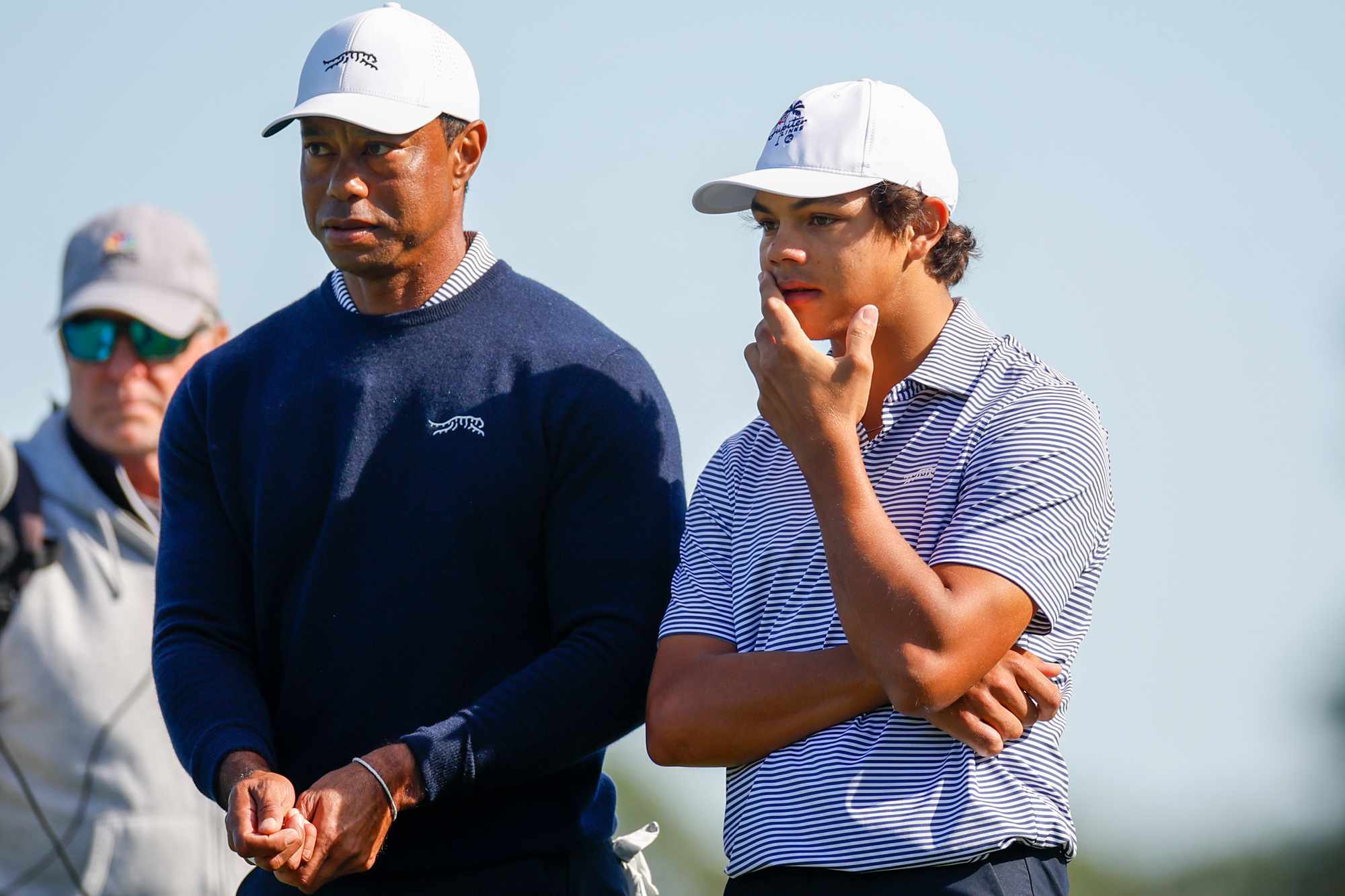 Tiger Woods talks with his son Charlie Woods while they play the second hole during the first round of the PNC Championship at Ritz-Carlton Golf Club on December 21, 2024 in Orlando, Florida. 