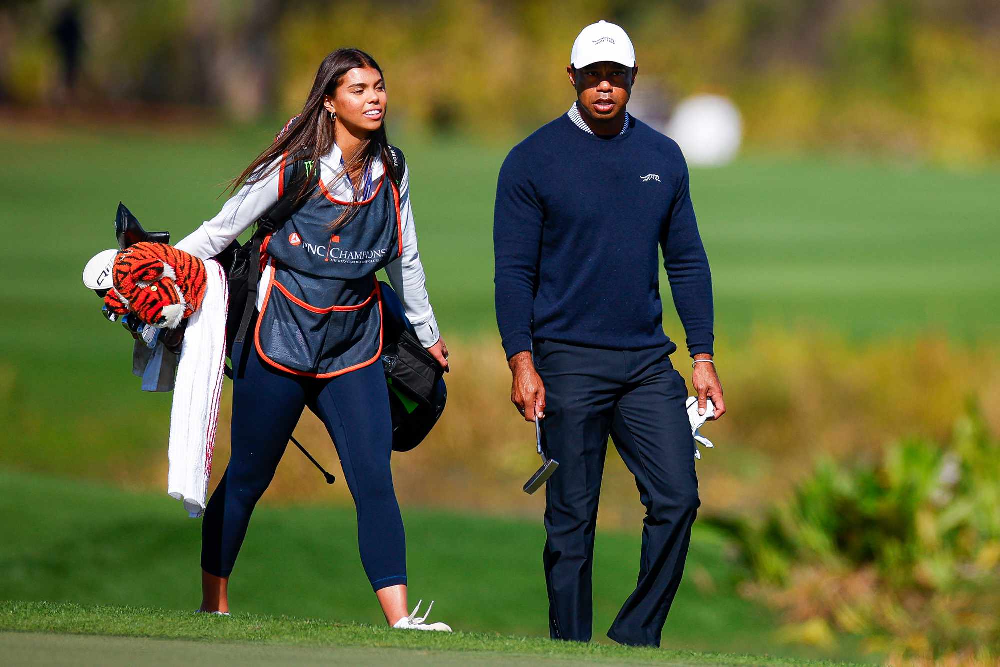 Tiger Woods and his daughter Sam Woods walk the fifth hole during the first round of the PNC Championship at Ritz-Carlton Golf Club on December 21, 2024 in Orlando,