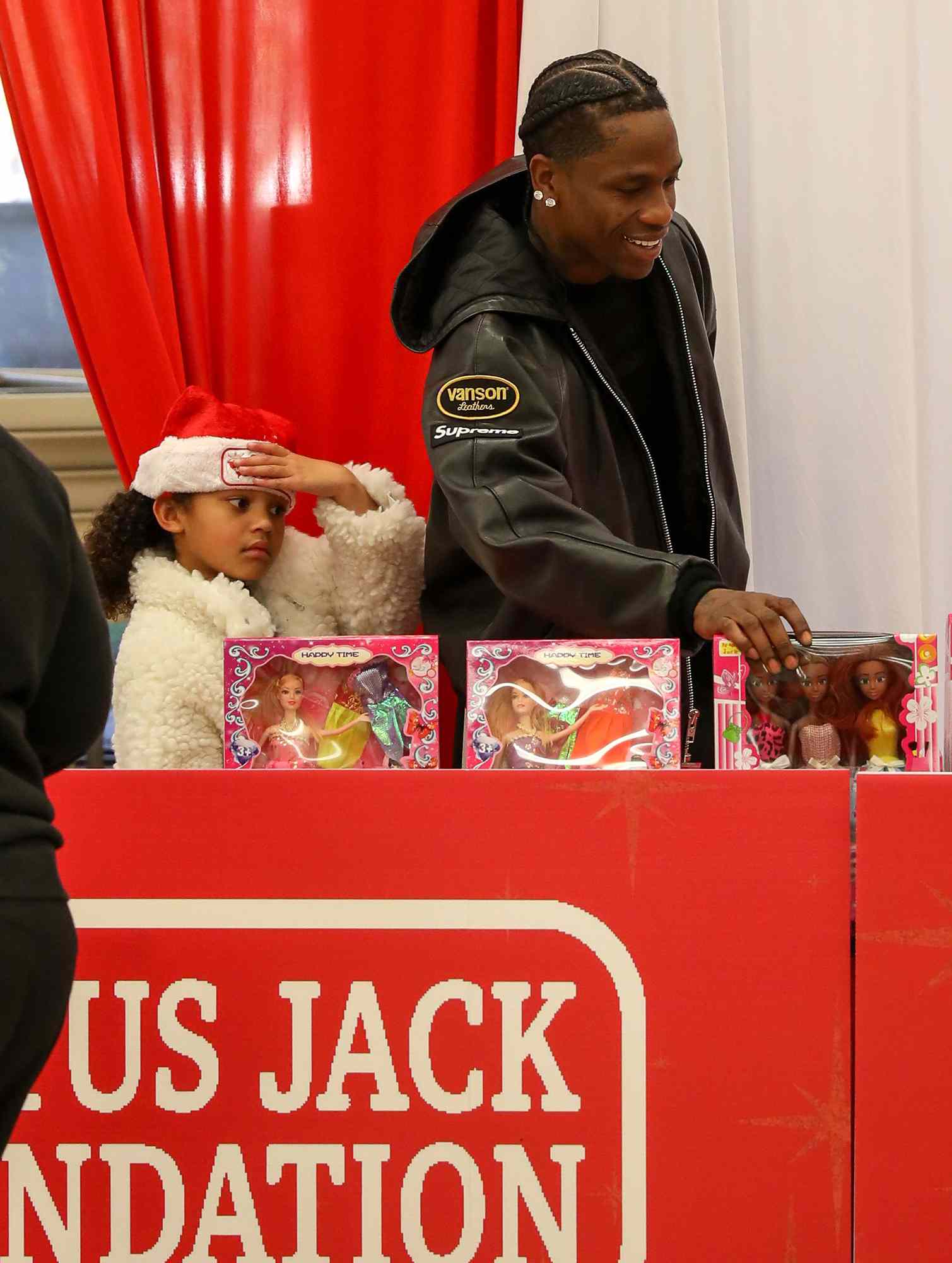 Stormi Webster and Travis Scott attend Travis Scott's Cactus Jack Foundation hosts 5th Annual 'Winter Wonderland' Theme Park and Holiday Drive, Texas Southern University, Houston, Texas, USA - 21 Dec 2024