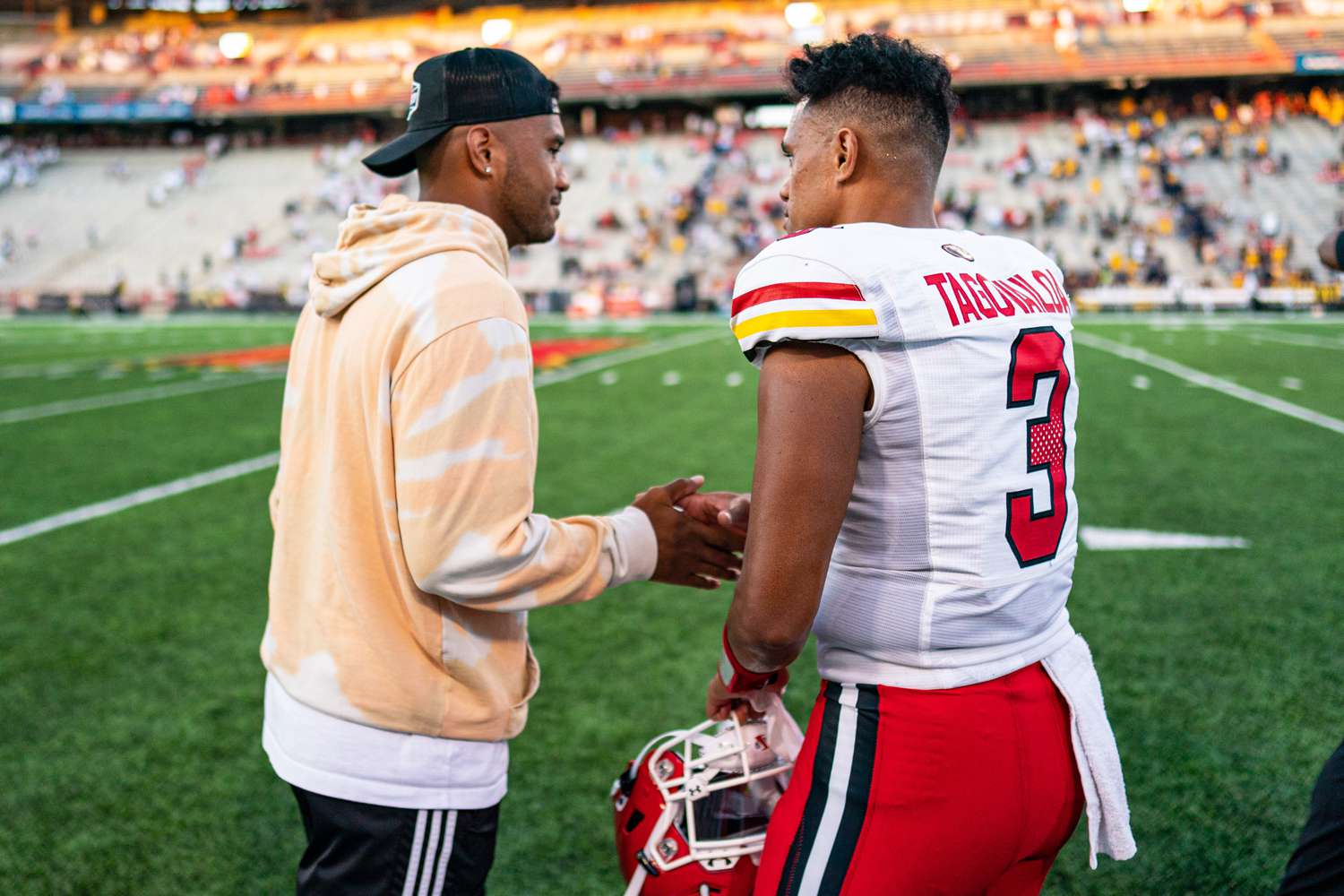 Maryland Terrapins quarterback Taulia Tagovailoa and brother Tua Tagovailoa after the game between West Virginia and Maryland on September 4, 2021 at Maryland Stadium in College Park, MD.