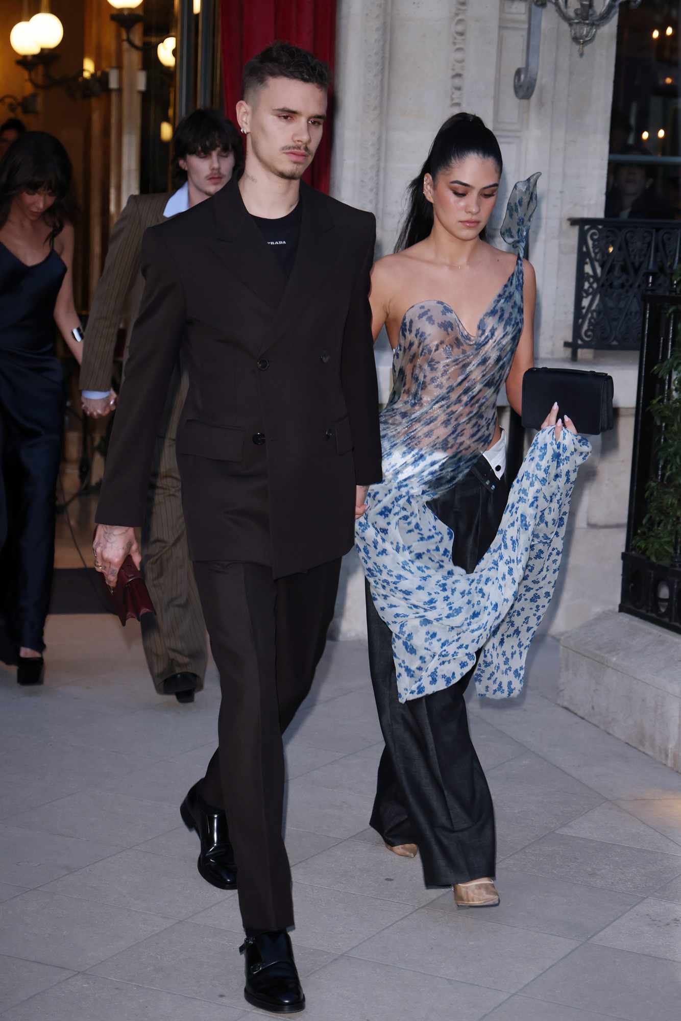 Romeo Beckham and Kim Turnbull leaving their hotel to head to the Victoria Beckham show during the Womenswear Fall/Winter 2025/2026