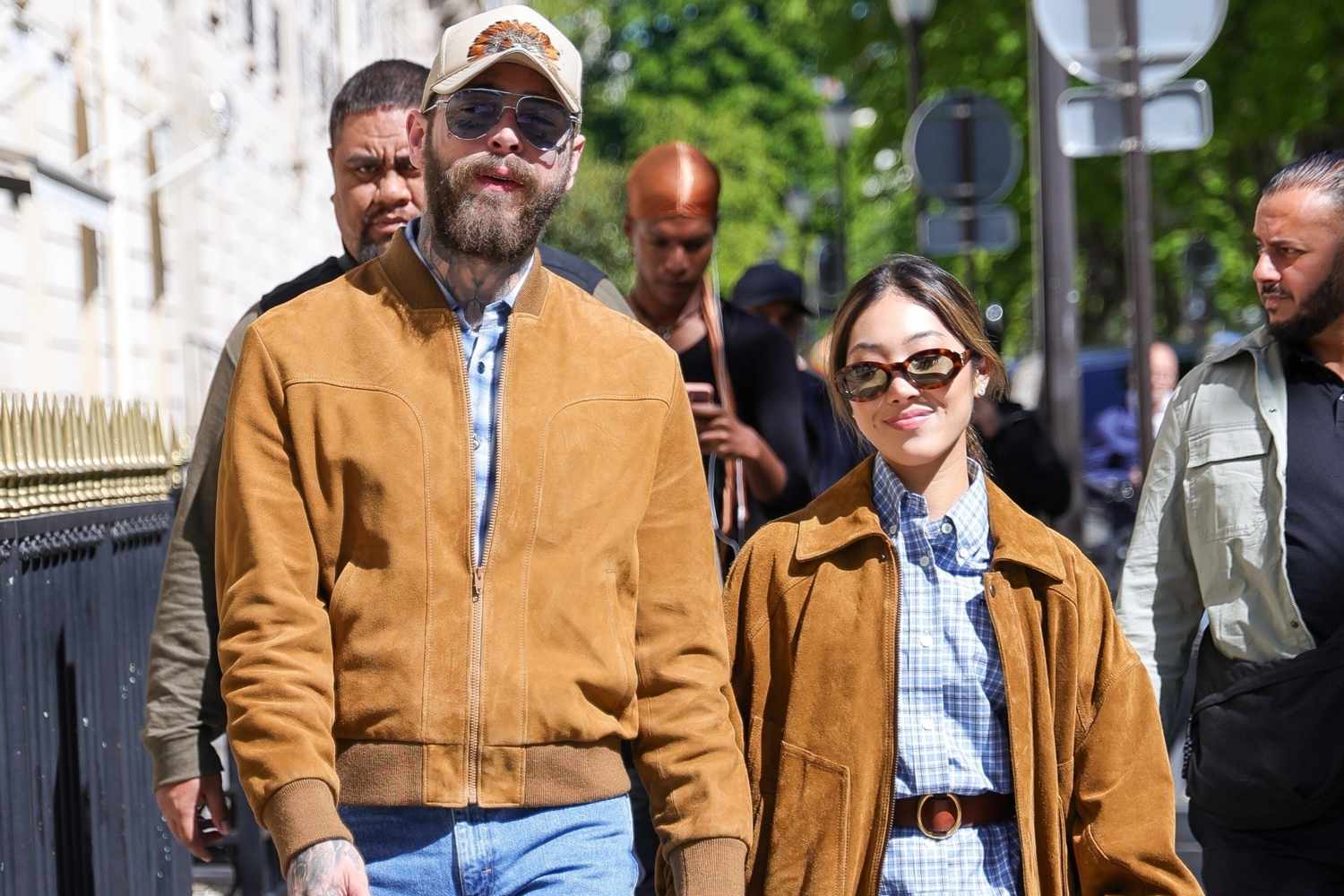 Post Malone and his girlfriend Christy Lee were spotted sharing a loving kiss on Avenue Montaigne in Paris during a shopping excursion.