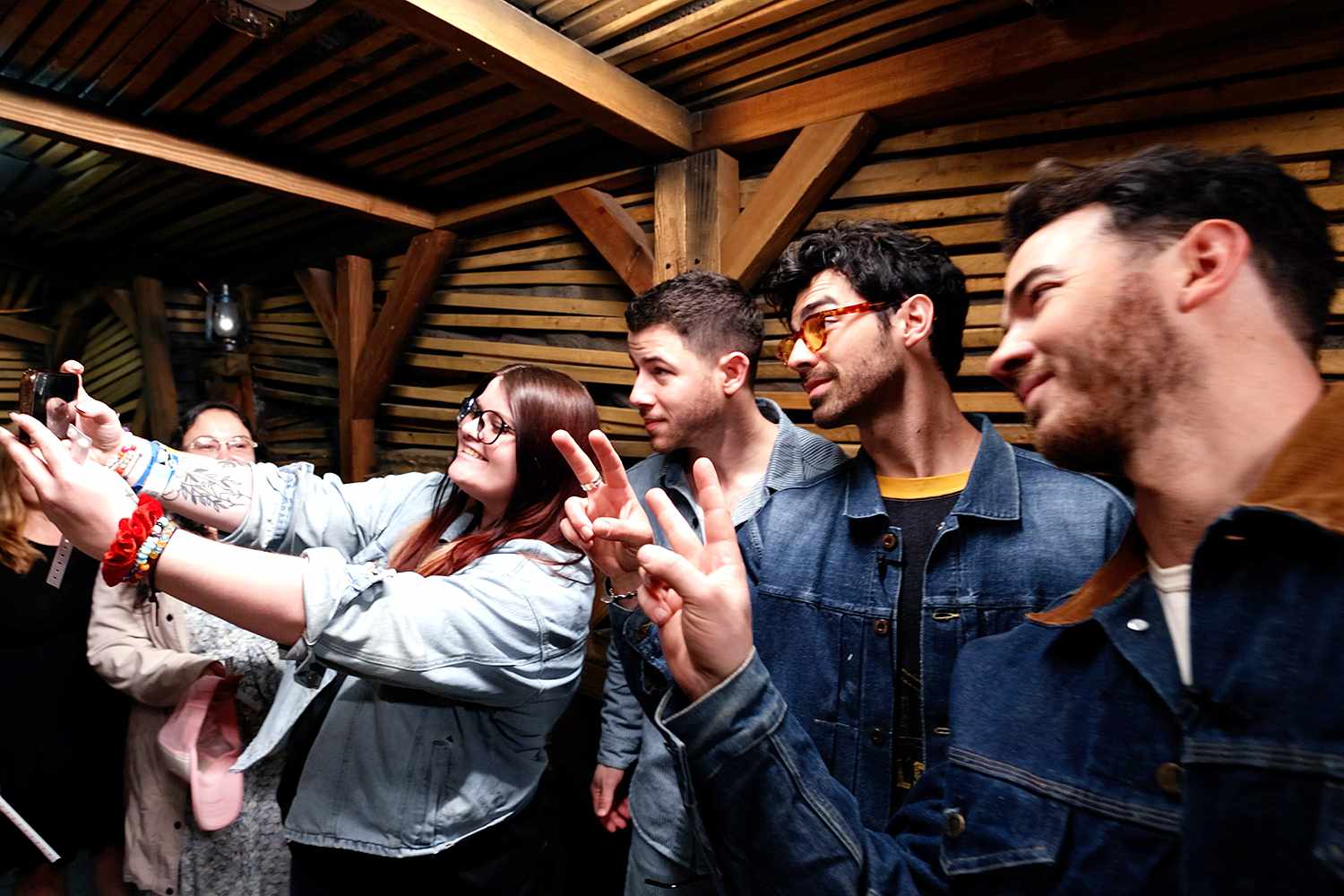JONAS BROTHERS SURPRISE DEDICATED FANS DURING INTERACTIVE EVENT