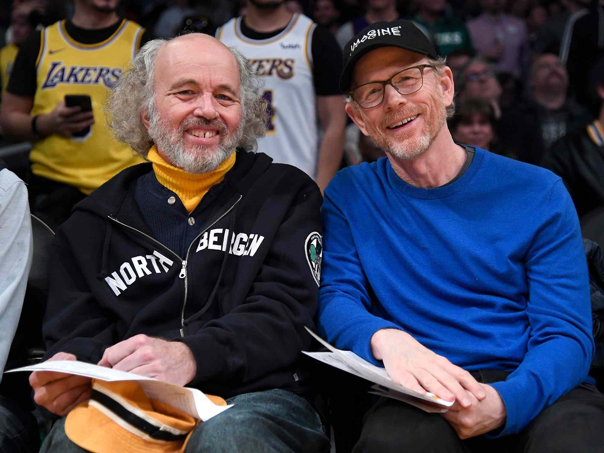 Clint Howard and Ron Howard attend a basketball game between the Los Angeles Lakers and the Milwaukee Bucks